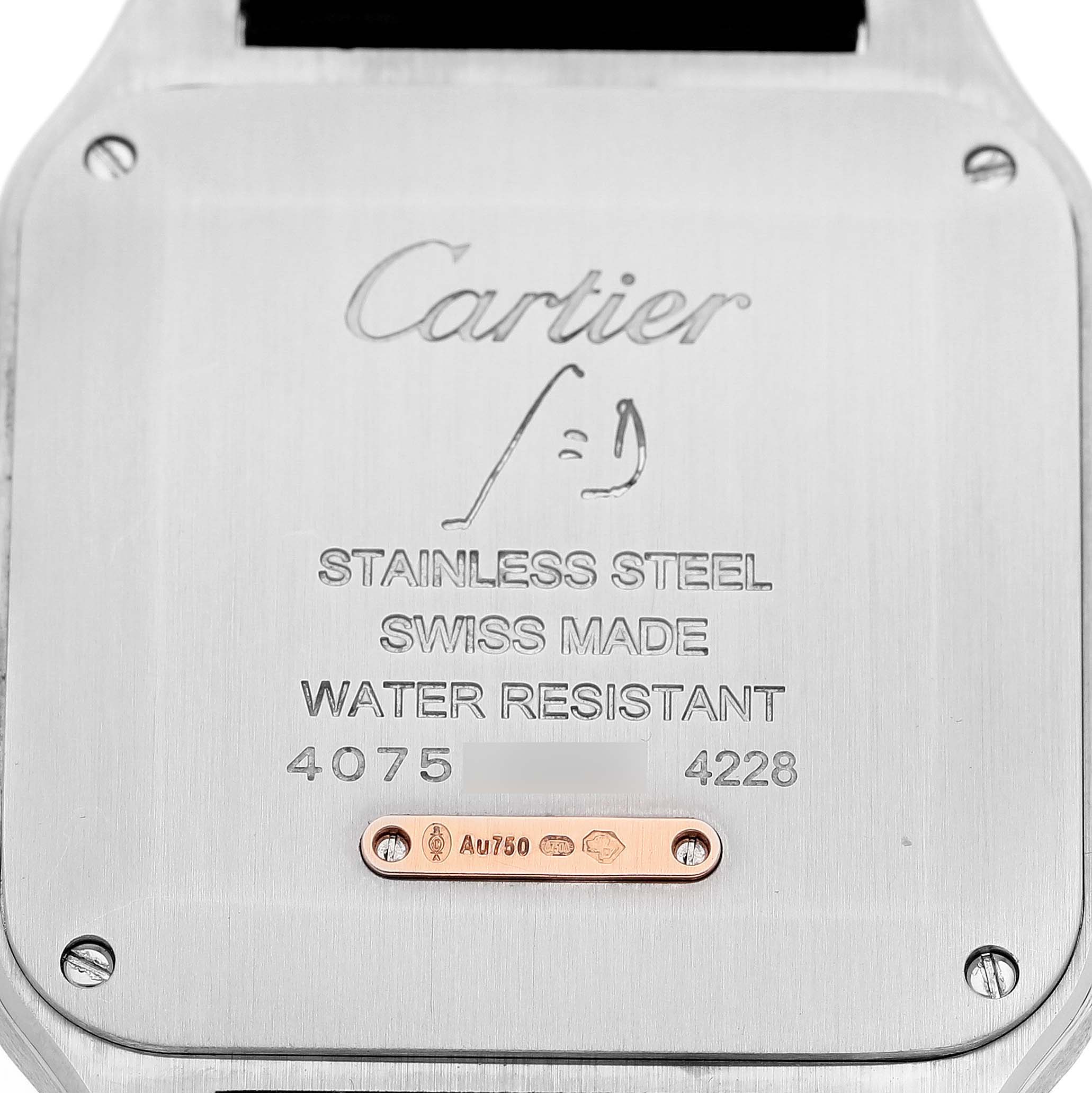 The image shows the back case of a Santos Dumont watch by Cartier, displaying engravings and serial numbers.