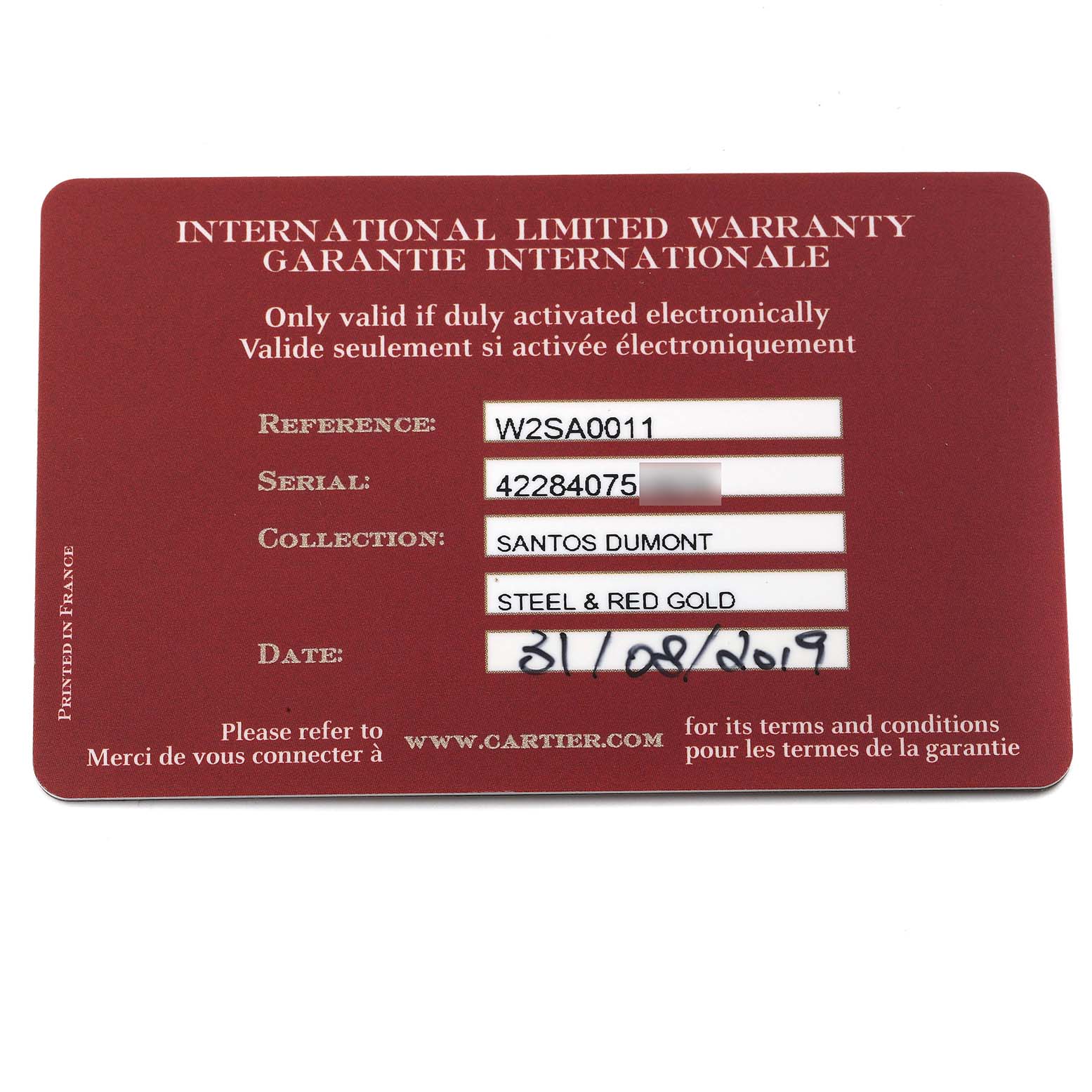 This is a Cartier Santos Dumont W2SA0011 Men's Steel and Gold (two tone) Silver Dial W2SA0011 Men's Steel and Gold (two tone) Silver Dial warranty card shown from a top-down angle.