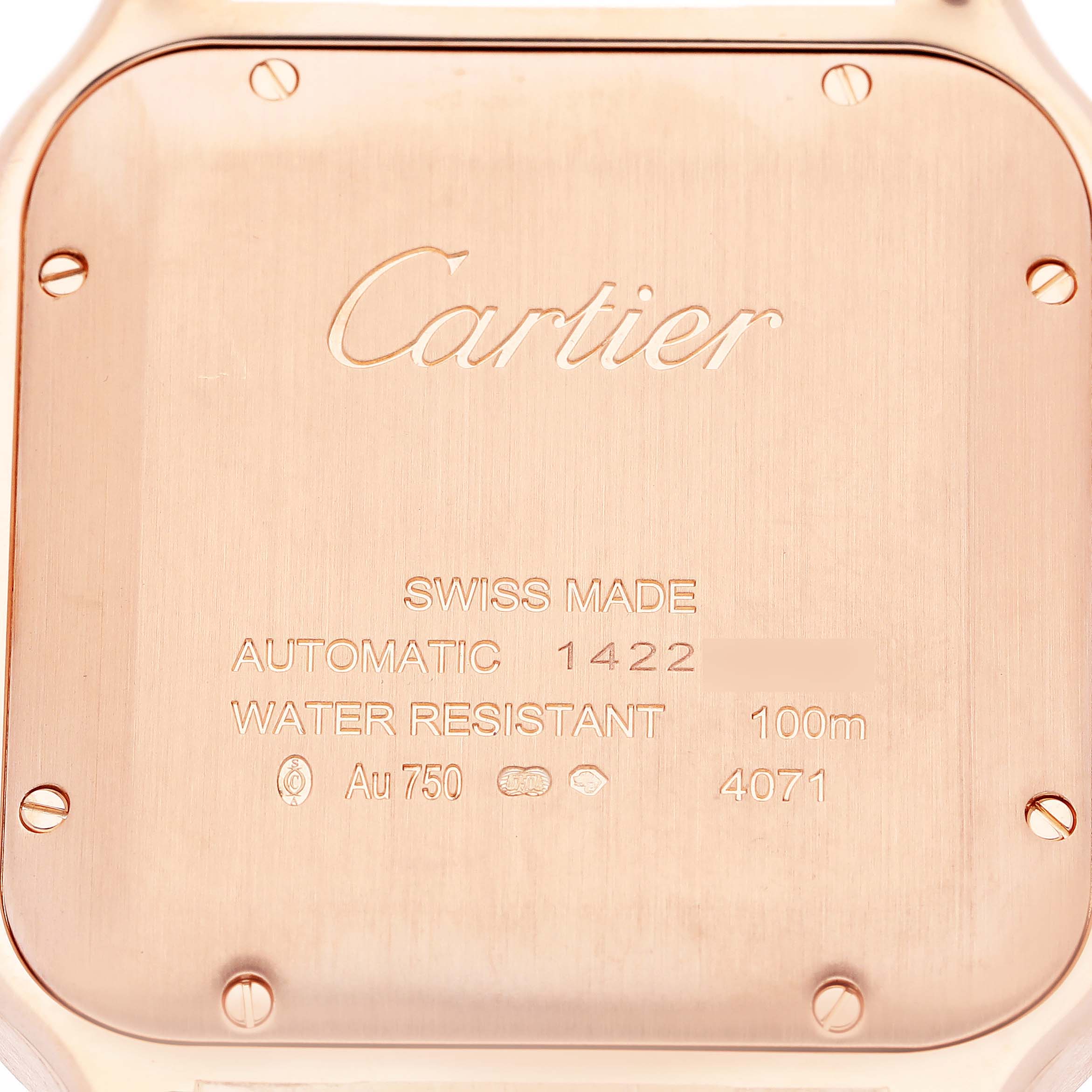 The image shows the back case of a Cartier Santos WGSA0019 Men's Rose Gold Silver Dial WGSA0019 Men's Rose Gold Silver Dial watch at a top-down angle, displaying engravings and screws.
