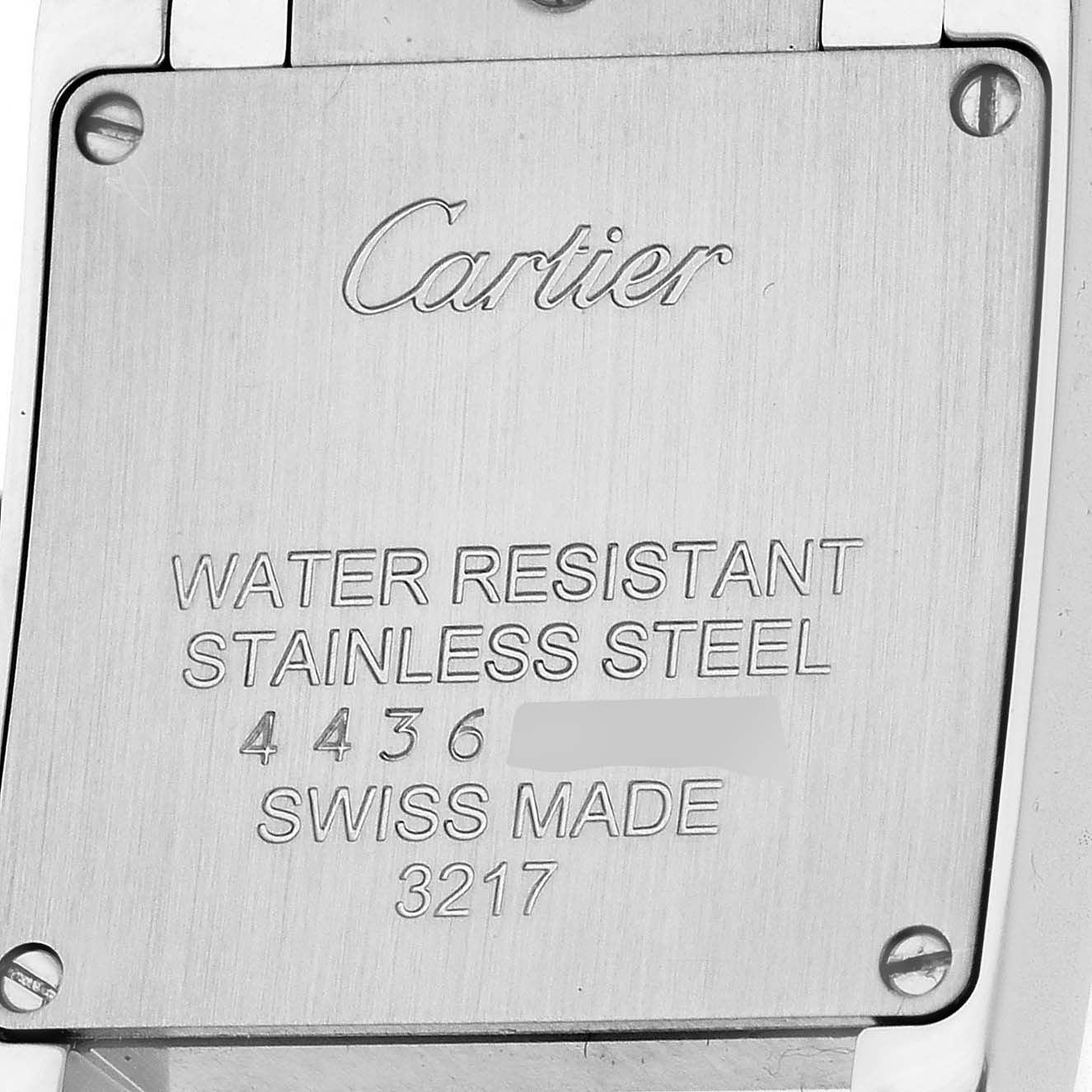 The image shows the back case of the Cartier Tank Francaise W4TA0008 Women's Stainless Steel Silver Dial watch, featuring engraved details on water resistance and material.