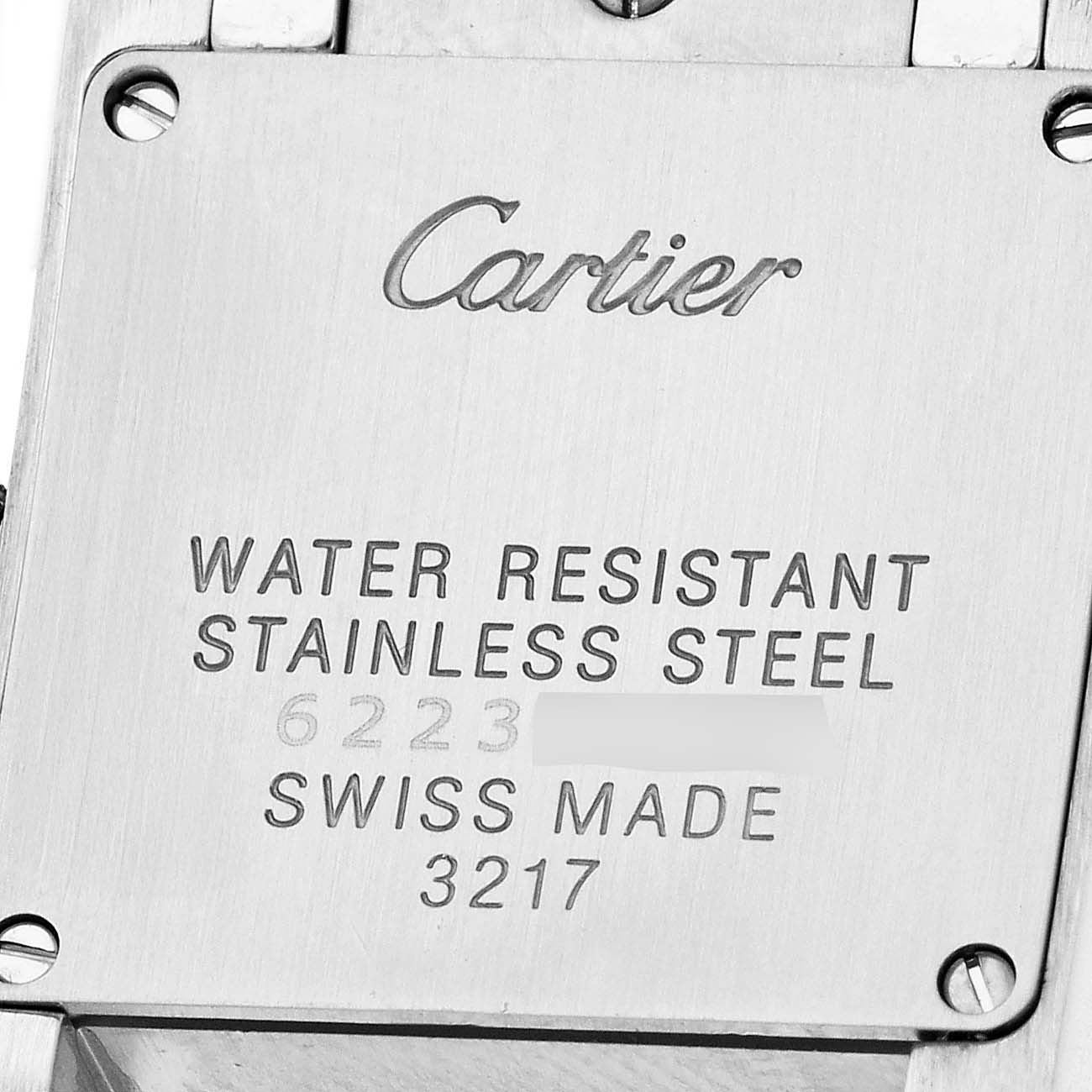 The image shows the back of a Cartier Tank Française watch, highlighting its stainless steel case and water resistance details.