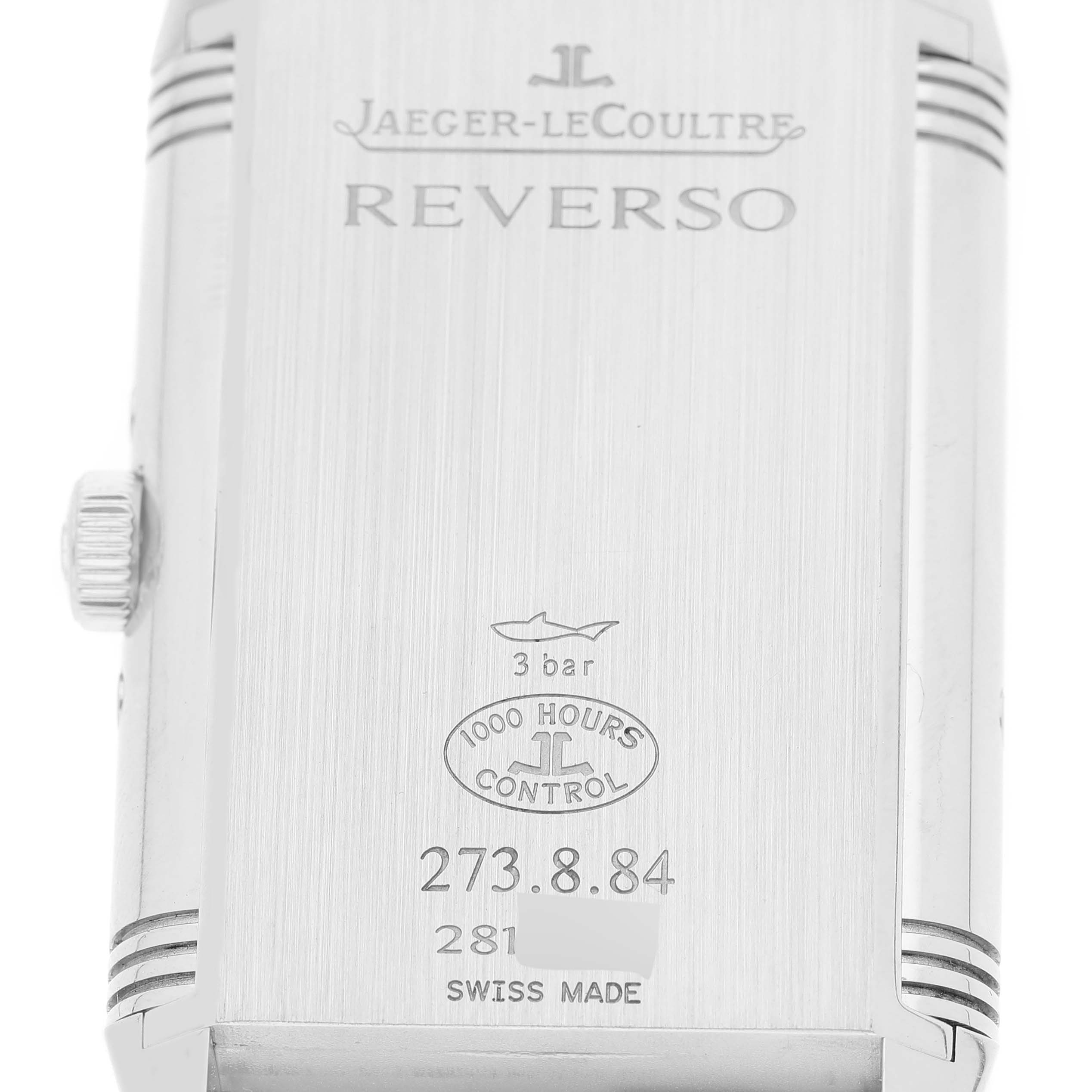 This image shows the back case of the Jaeger LeCoultre Reverso Q3758420 Men
s Stainless Steel Silver Dial Q3758420 Men
s Stainless Steel Silver Dial watch, displaying the model
s engravings and crown.