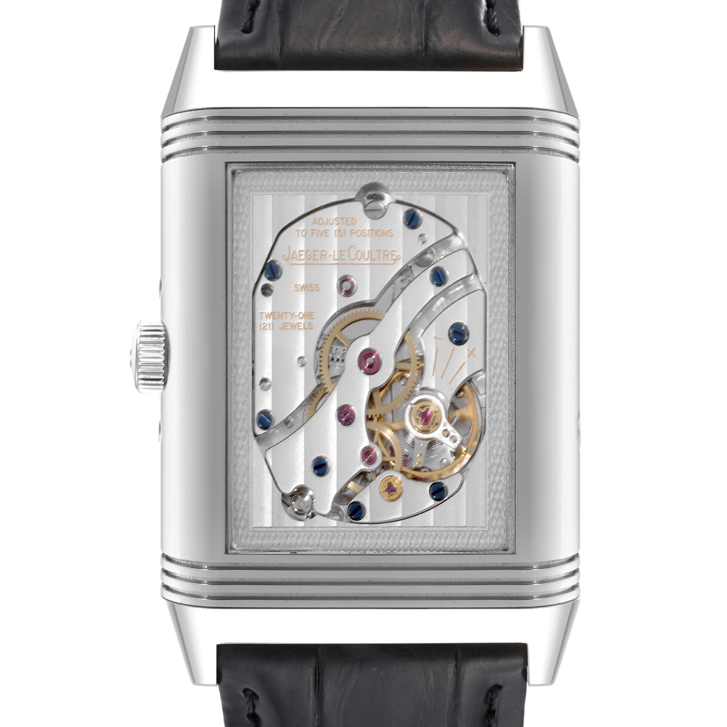 The image shows the back view of the Jaeger-LeCoultre Reverso watch, highlighting its intricate mechanical movement.
