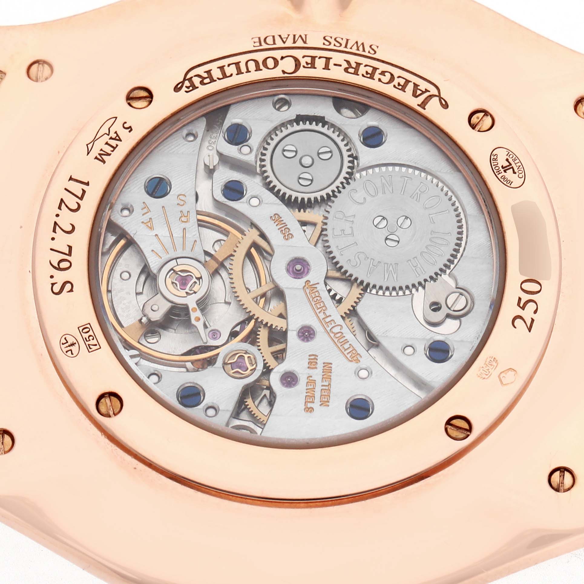 The image shows the back of a Jaeger-LeCoultre Master model watch, focusing on the intricate mechanical movement and gears.