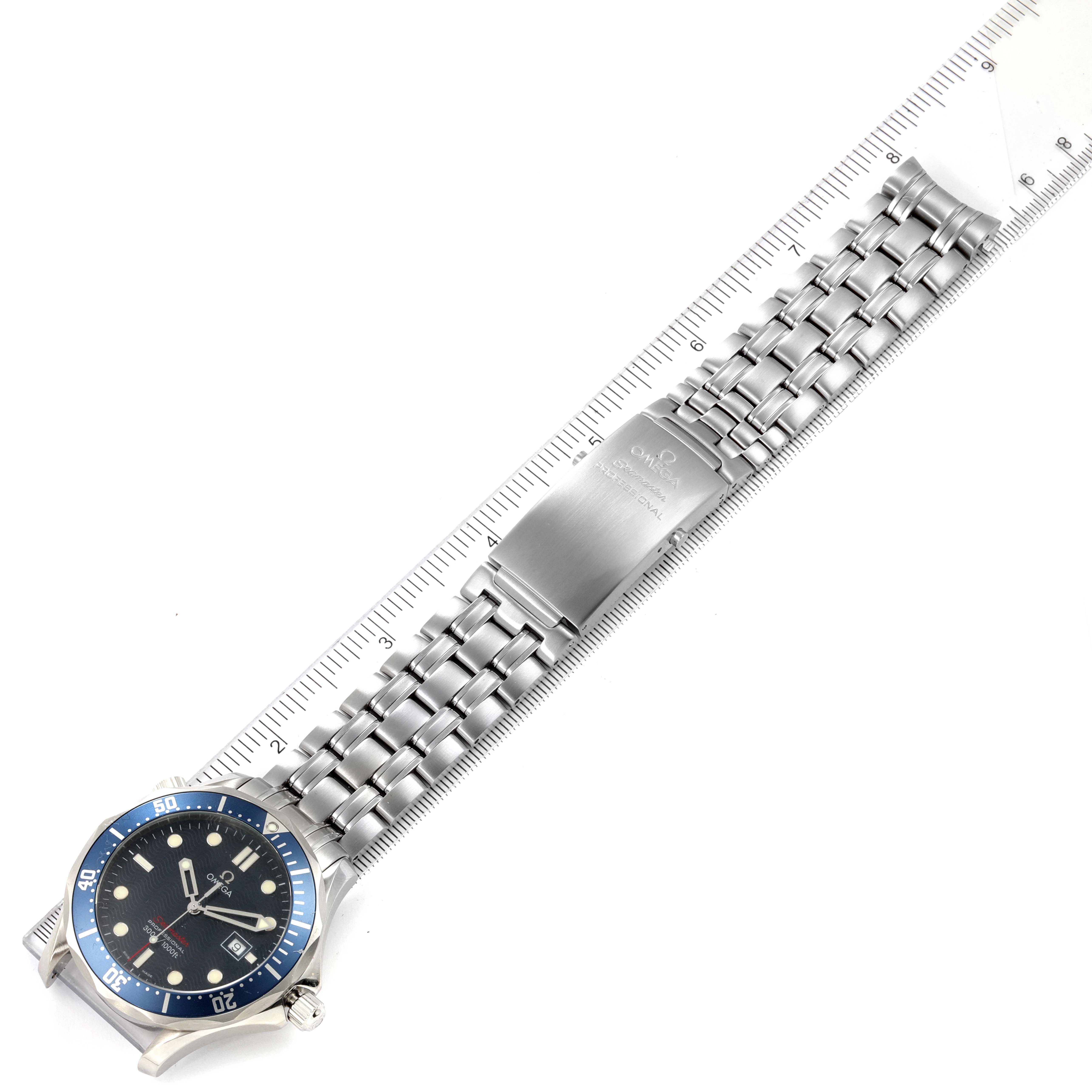 The image shows a top-down view of an Omega Seamaster 2221.80.00 Men's Stainless Steel Blue Dial 2221.80.00 Men's Stainless Steel Blue Dial watch, highlighting its face and metallic bracelet fully extended.