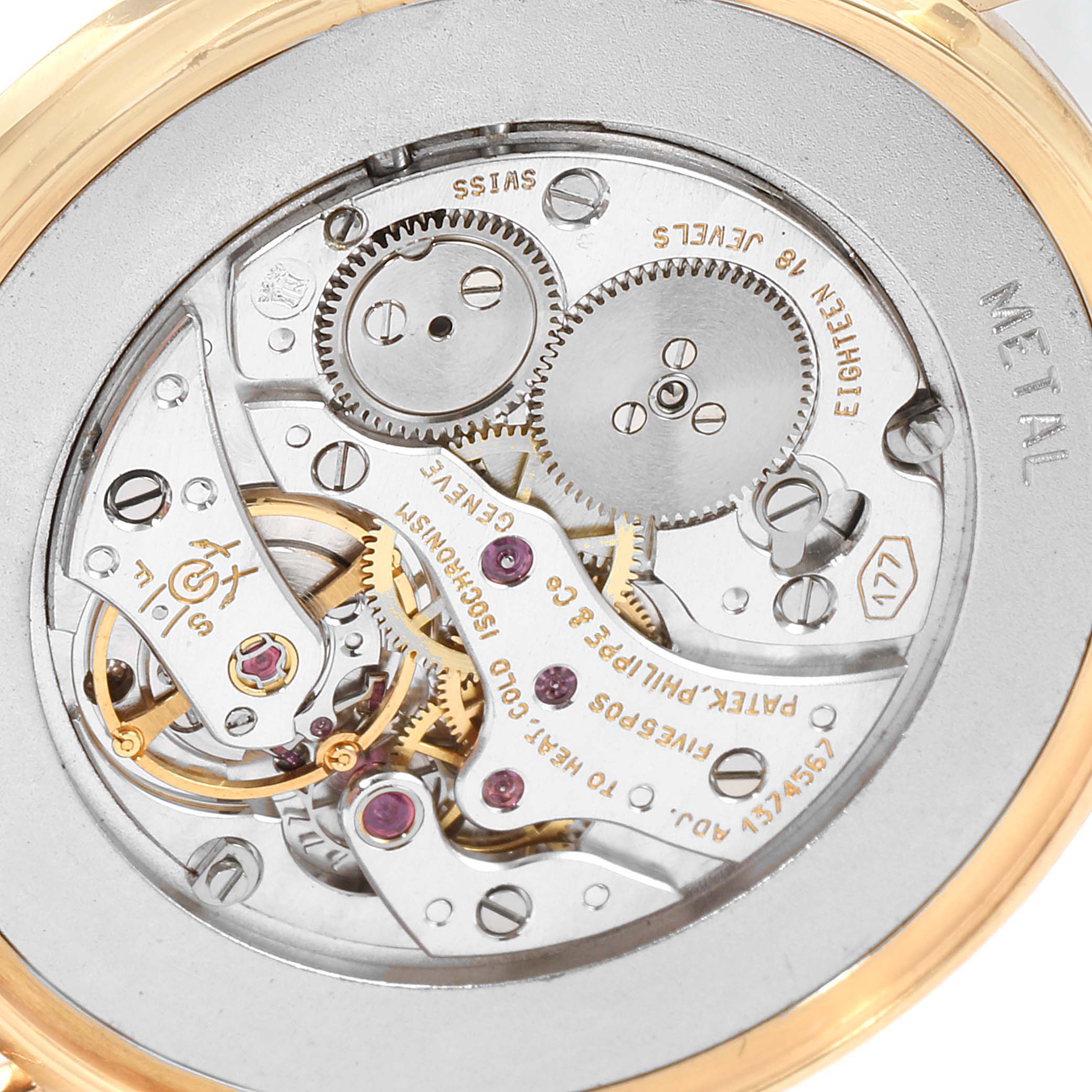 This image shows a close-up of the movement and inner workings of a Patek Philippe Calatrava 3520 Men's Yellow Gold White Dial 3520 Men's Yellow Gold White Dial watch.