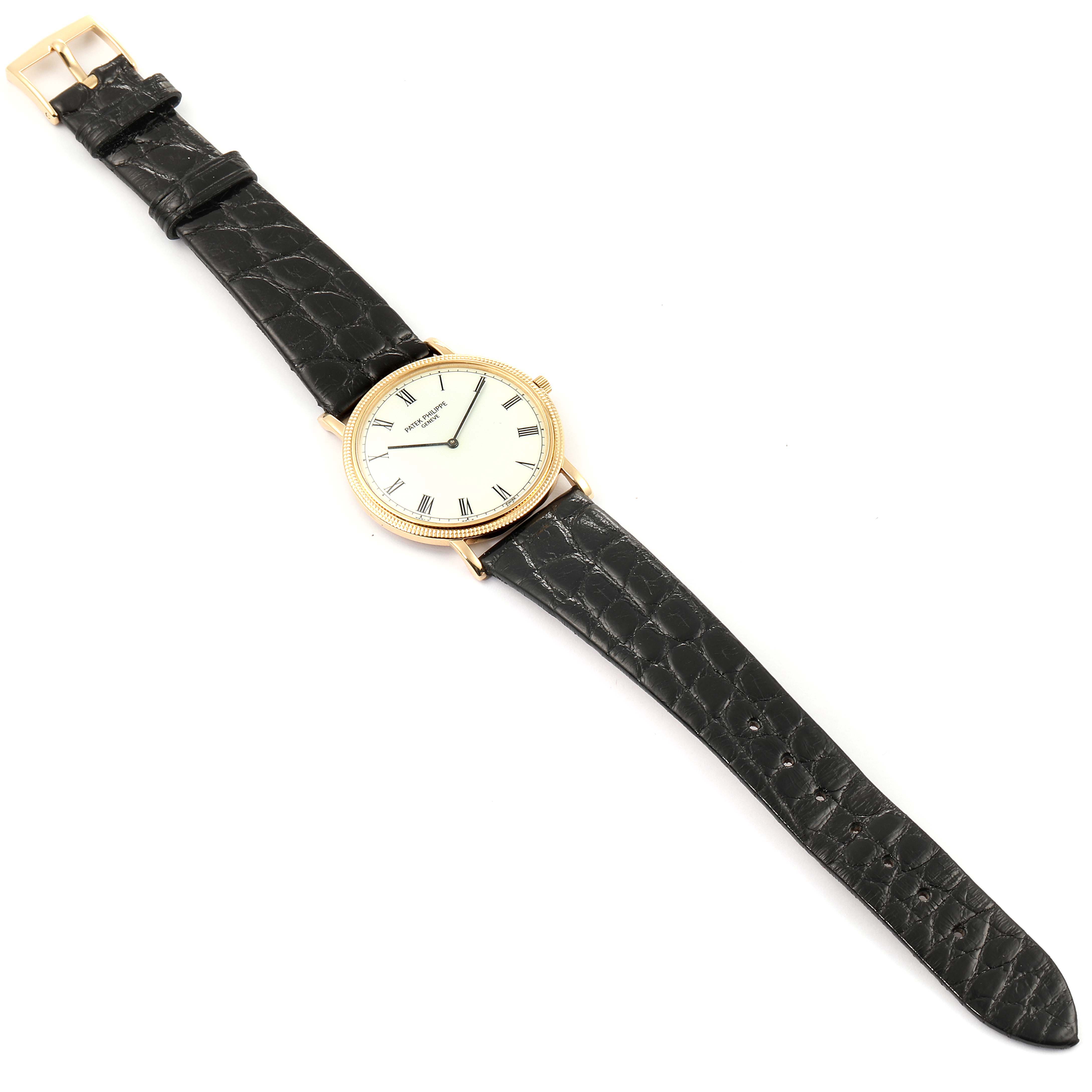 The image shows a Patek Philippe Calatrava 3520 Men's Yellow Gold White Dial 3520 Men's Yellow Gold White Dial watch with a leather strap, viewed from a top-down angle.