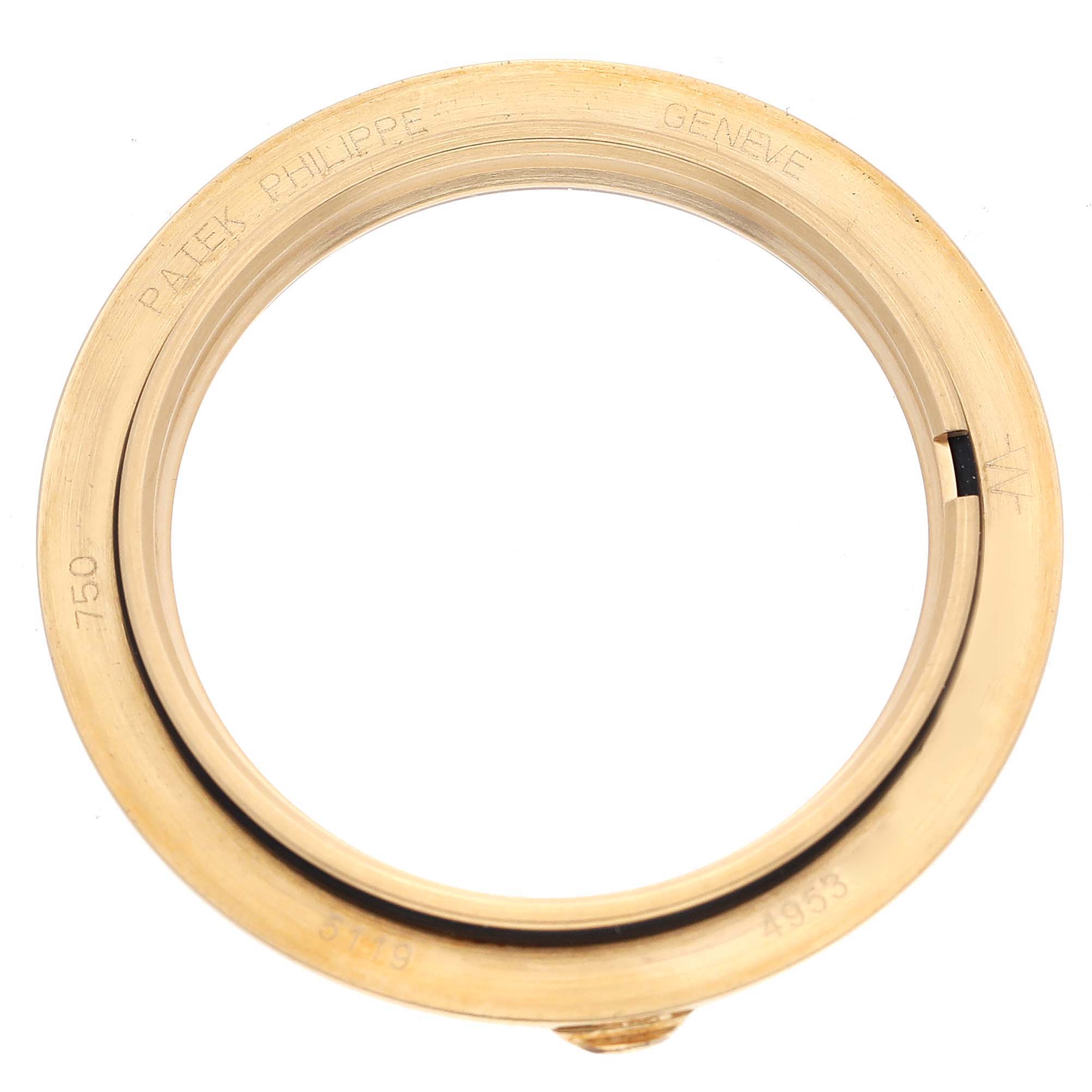 This image shows a gold bezel for a Patek Philippe Calatrava 5119J Men's Yellow Gold White Dial 5119J Men's Yellow Gold White Dial watch, with inscriptions visible on the inner side.