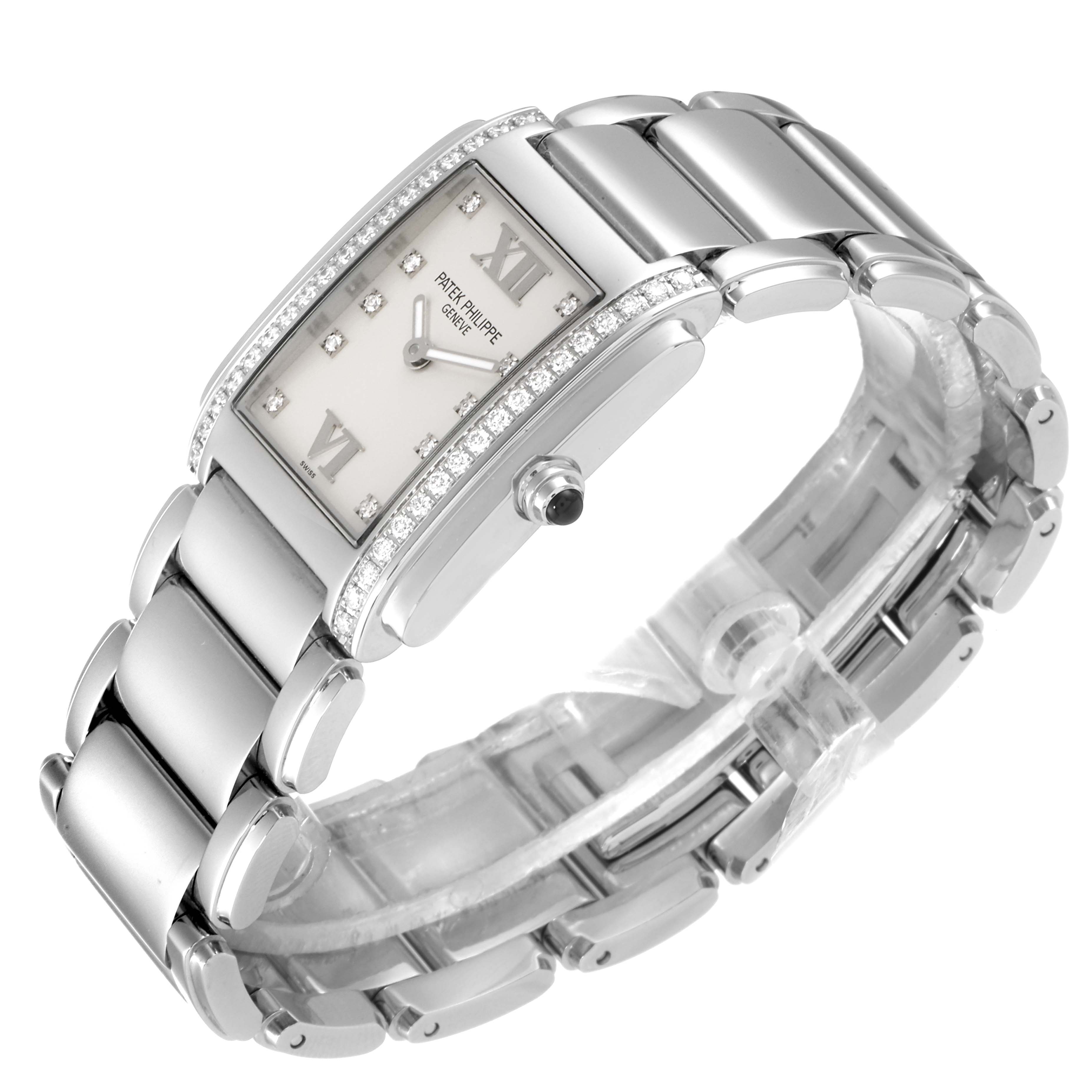 The Patek Philippe Twenty-4 4910/10A-010 Women's Stainless Steel Silver Dial 4910/10A-010 Women's Stainless Steel Silver Dial watch is shown at a side angle, highlighting the rectangular face, diamond bezel, and metal bracelet.
