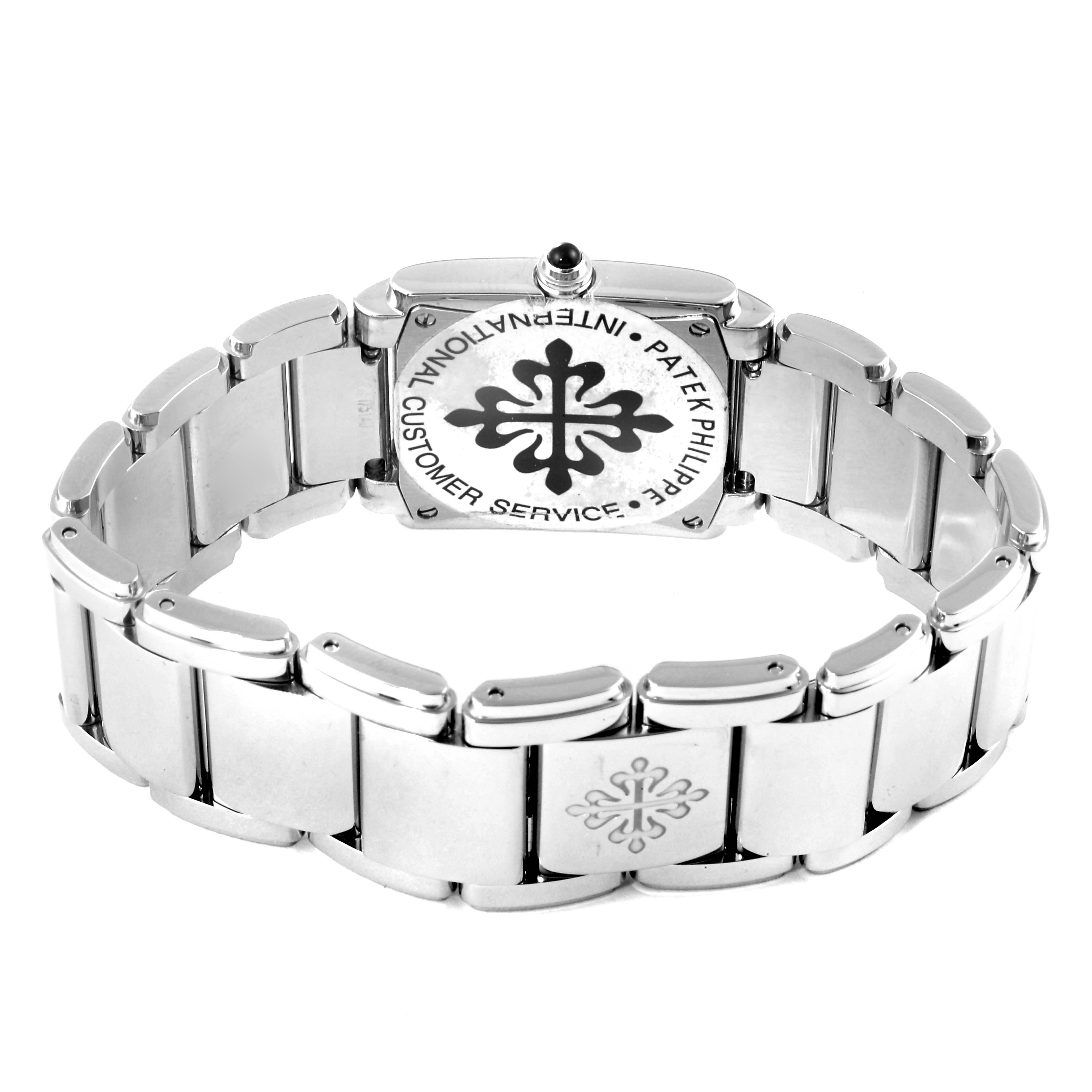 The image shows the back and strap of a Patek Philippe Twenty-4 4910/10A-010 Women's Stainless Steel Silver Dial 4910/10A-010 Women's Stainless Steel Silver Dial watch, highlighting its clasp and engraving.