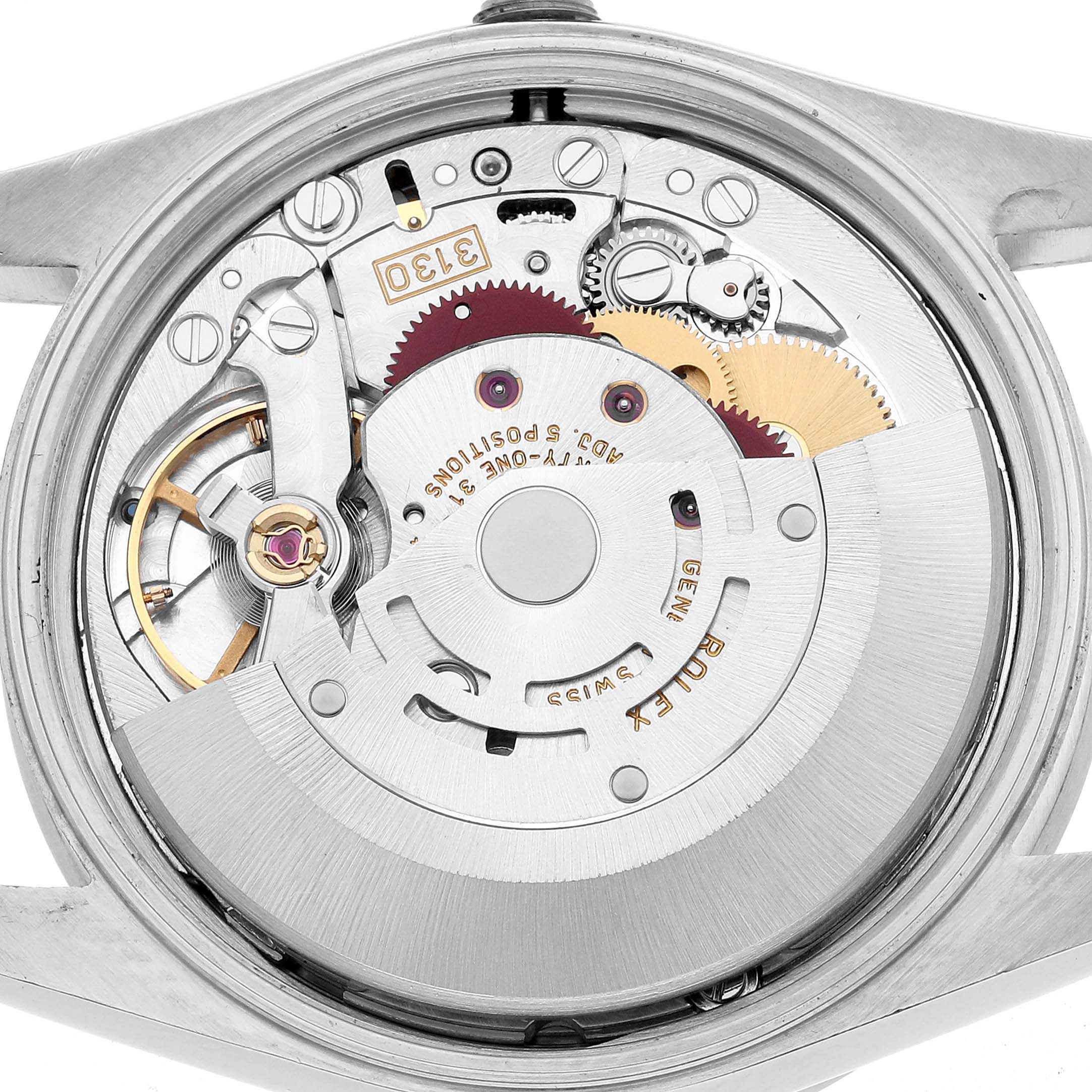 The image shows the movement of a Rolex Air-King 14010 Men's Stainless Steel White Dial watch from a top-down angle, revealing the intricate mechanical components.