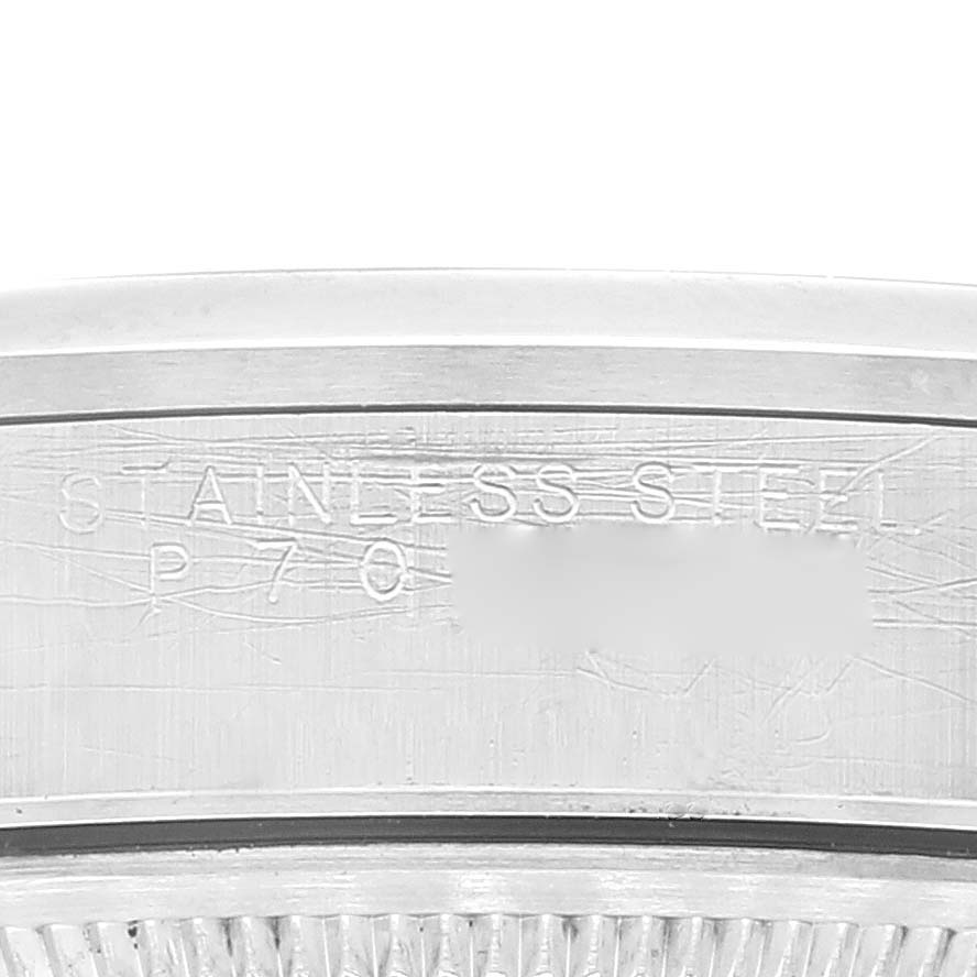This image shows a close-up angle of the stainless steel case back of the Rolex Air-King 14000M Men's Stainless Steel Black Dial 14000M Men's Stainless Steel Black Dial watch with engraved text.