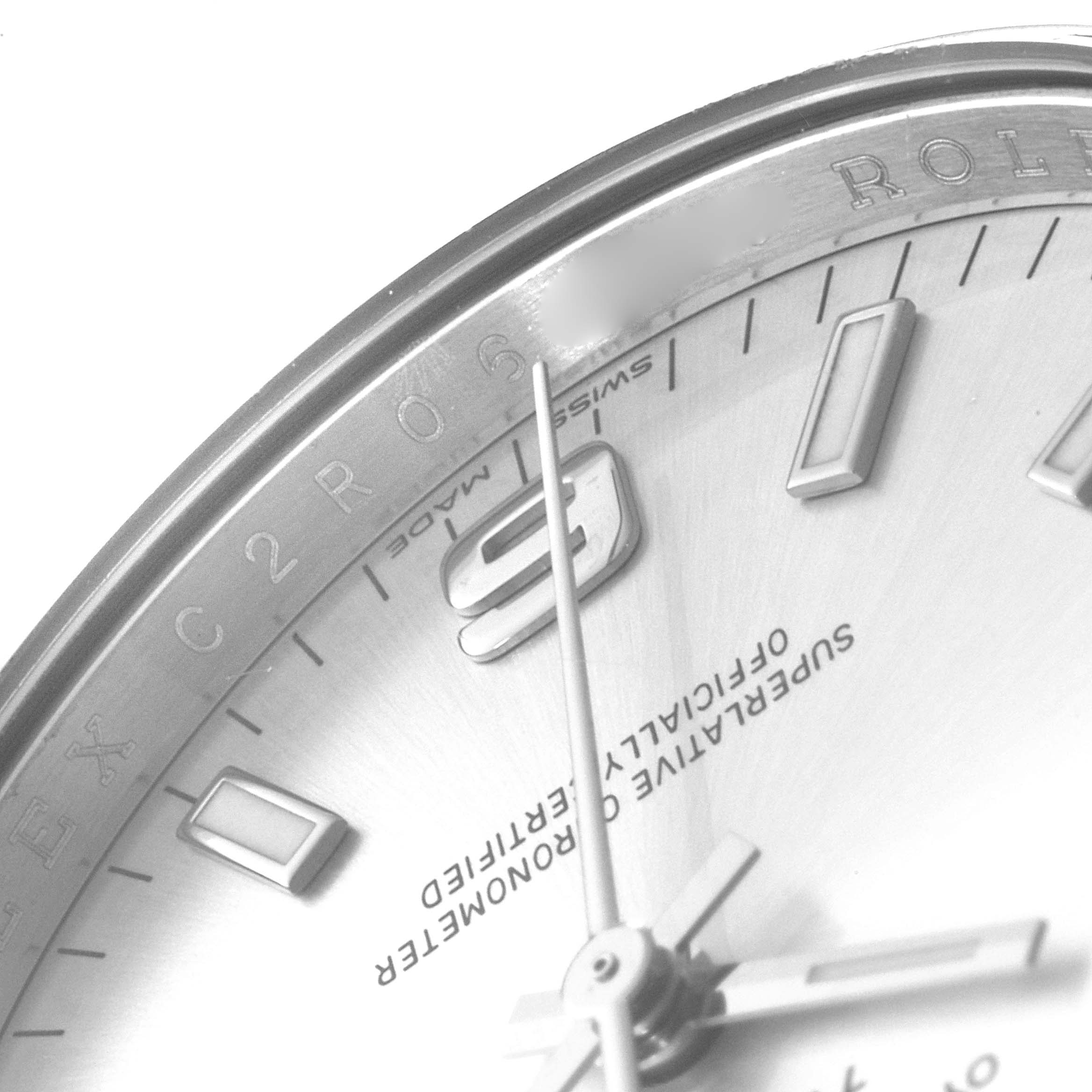 This image shows a close-up angle of the face and dial of a Rolex Air-King 114200 Men's Stainless Steel Silver Dial 114200 Men's Stainless Steel Silver Dial watch, highlighting the 9 o'clock marker and inscriptions.