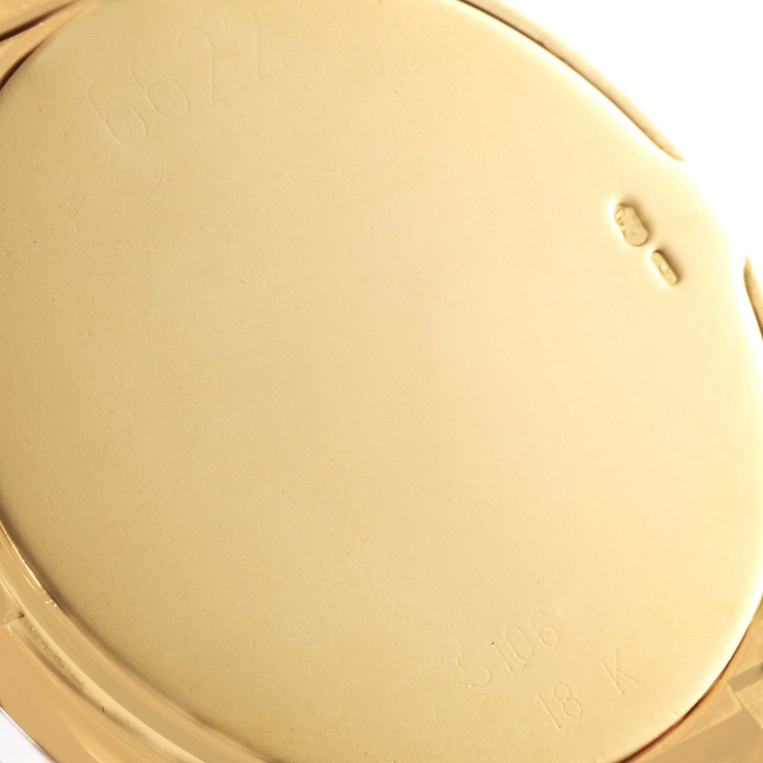 The image shows a close-up of the back case of a Rolex Cellini 6622 Men's Yellow Gold Champagne Dial 6622 Men's Yellow Gold Champagne Dial watch, highlighting the engravings and the 18K gold marking.
