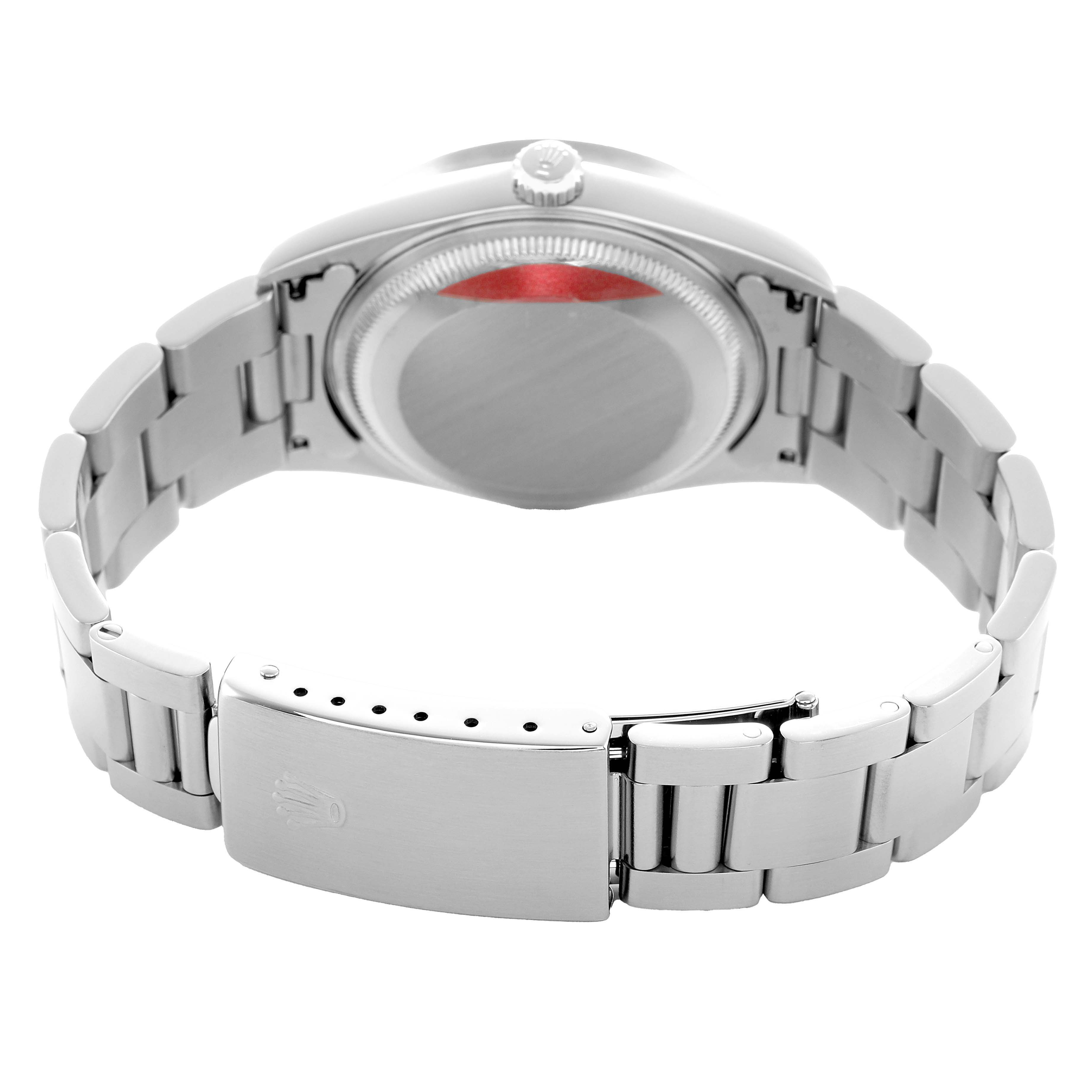 The image shows the back view of a Rolex Date 15210 Men's Stainless Steel Black Dial model, highlighting the case back and metal bracelet with the clasp.