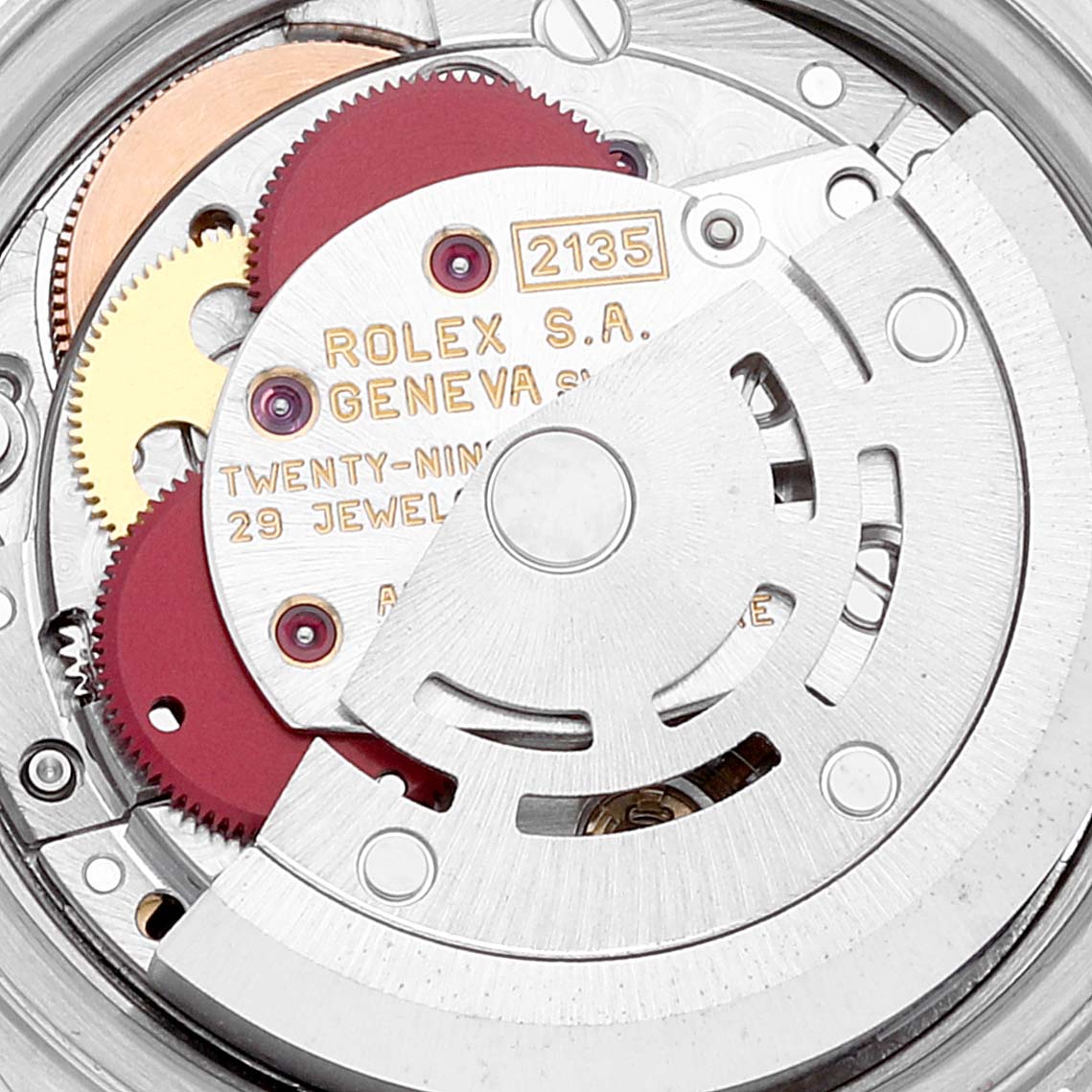 This image shows the internal mechanism of a Rolex Datejust 69173 Women's Steel and Gold (two tone) Black Dial 69173 Women's Steel and Gold (two tone) Black Dial watch, including gears, the rotor, and inscriptions.