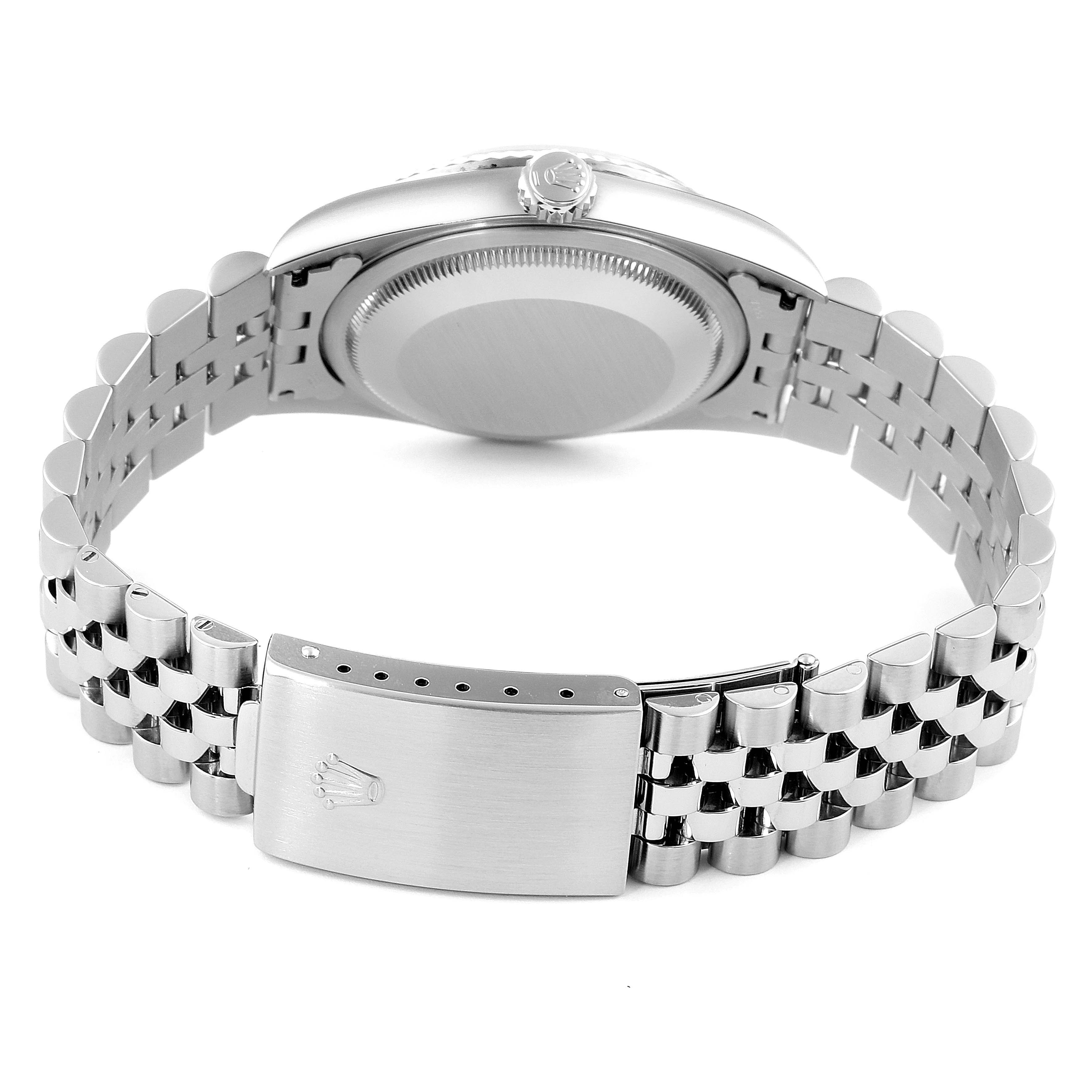 The image shows the back of a Rolex Datejust 16234 Men's Stainless Steel Blue Dial 16234 Men's Stainless Steel Blue Dial watch, focusing on the case, crown, and bracelet clasp.