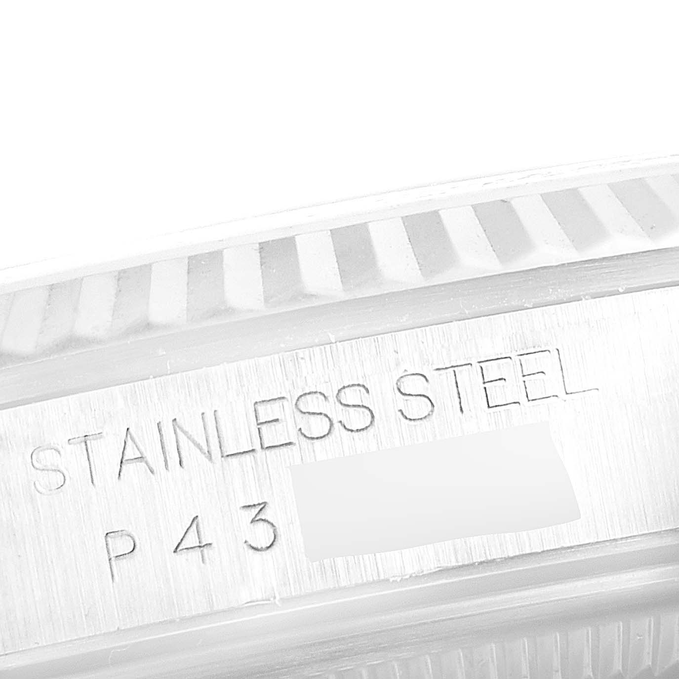 The image shows a close-up of the side engraving on the stainless steel casing of a Rolex Datejust 16234 Men's Stainless Steel Blue Dial 16234 Men's Stainless Steel Blue Dial watch.