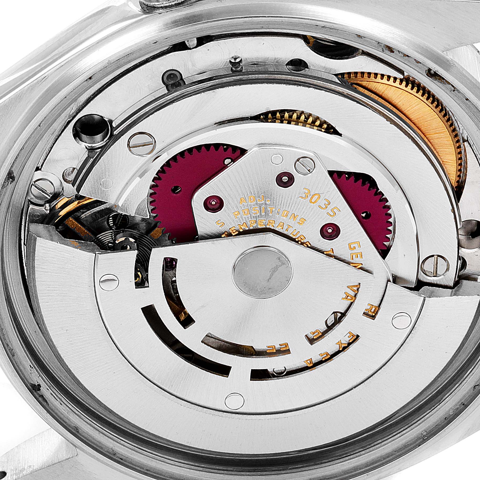 This image shows an angled close-up of the internal mechanism of a Vintage Collection Rolex watch.