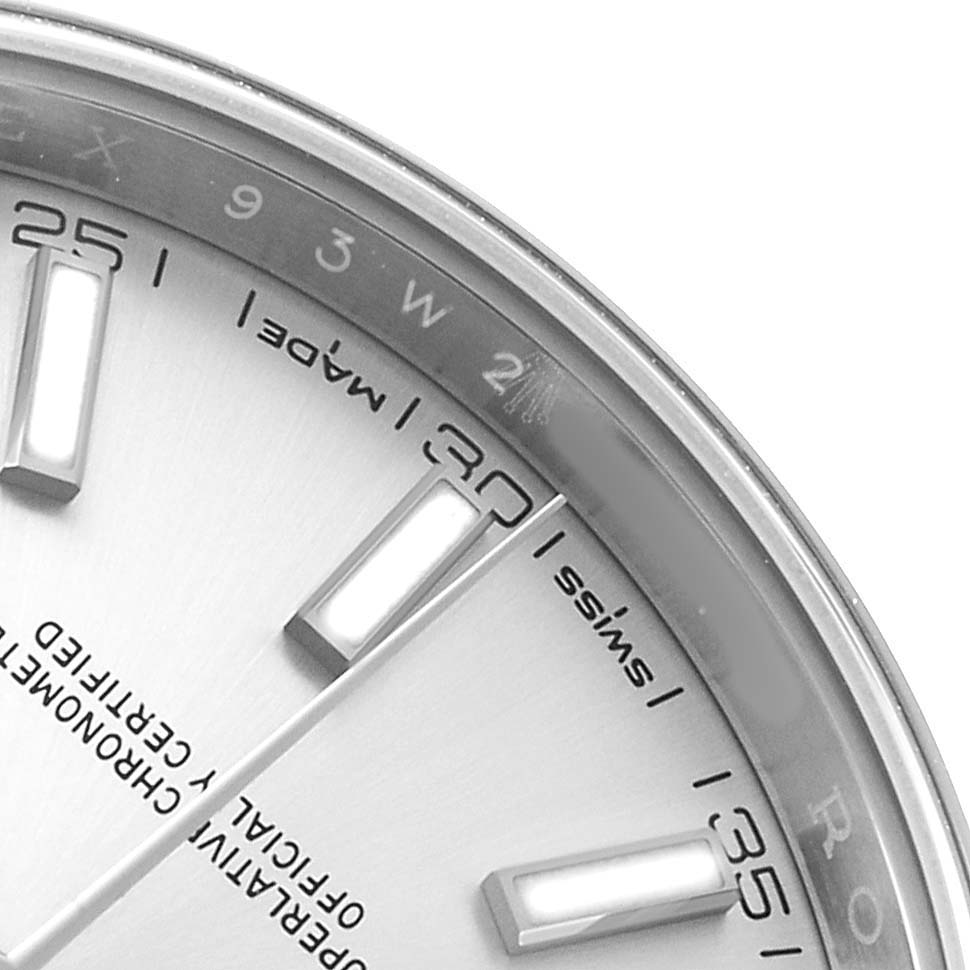 The image shows a close-up of a Rolex Datejust 41 126300 Men's Stainless Steel Silver Dial watch dial at an angle, highlighting the indices and partial bezel.
