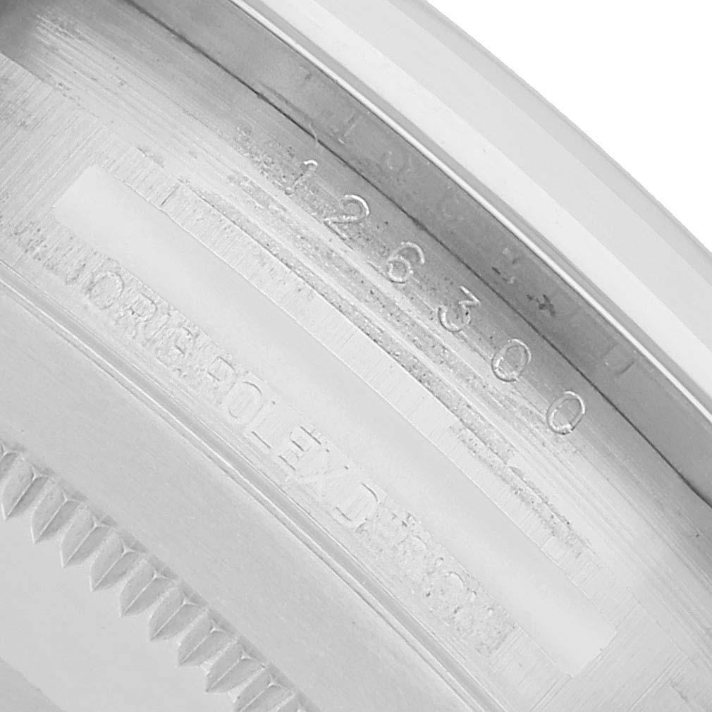 This image shows the inner bezel engraving of a Rolex Datejust 41 126300 Men's Stainless Steel Silver Dial, highlighting the model number.