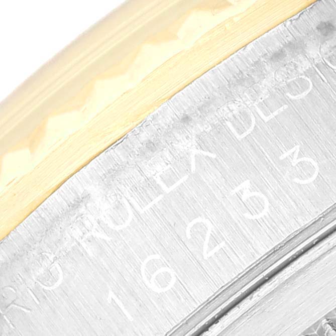 This image shows a close-up of the side of the case and bezel of a Rolex Datejust 16233 Men's Steel and Gold (two tone) Black Dial 16233 Men's Steel and Gold (two tone) Black Dial watch, revealing engraved model details.