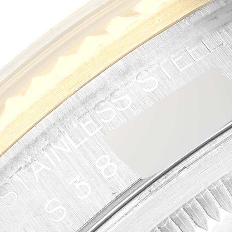 A close-up image of the side of a Rolex Datejust 16233 Men's Steel and Gold (two tone) Black Dial 16233 Men's Steel and Gold (two tone) Black Dial watch showing part of the stainless steel casing and bezel.