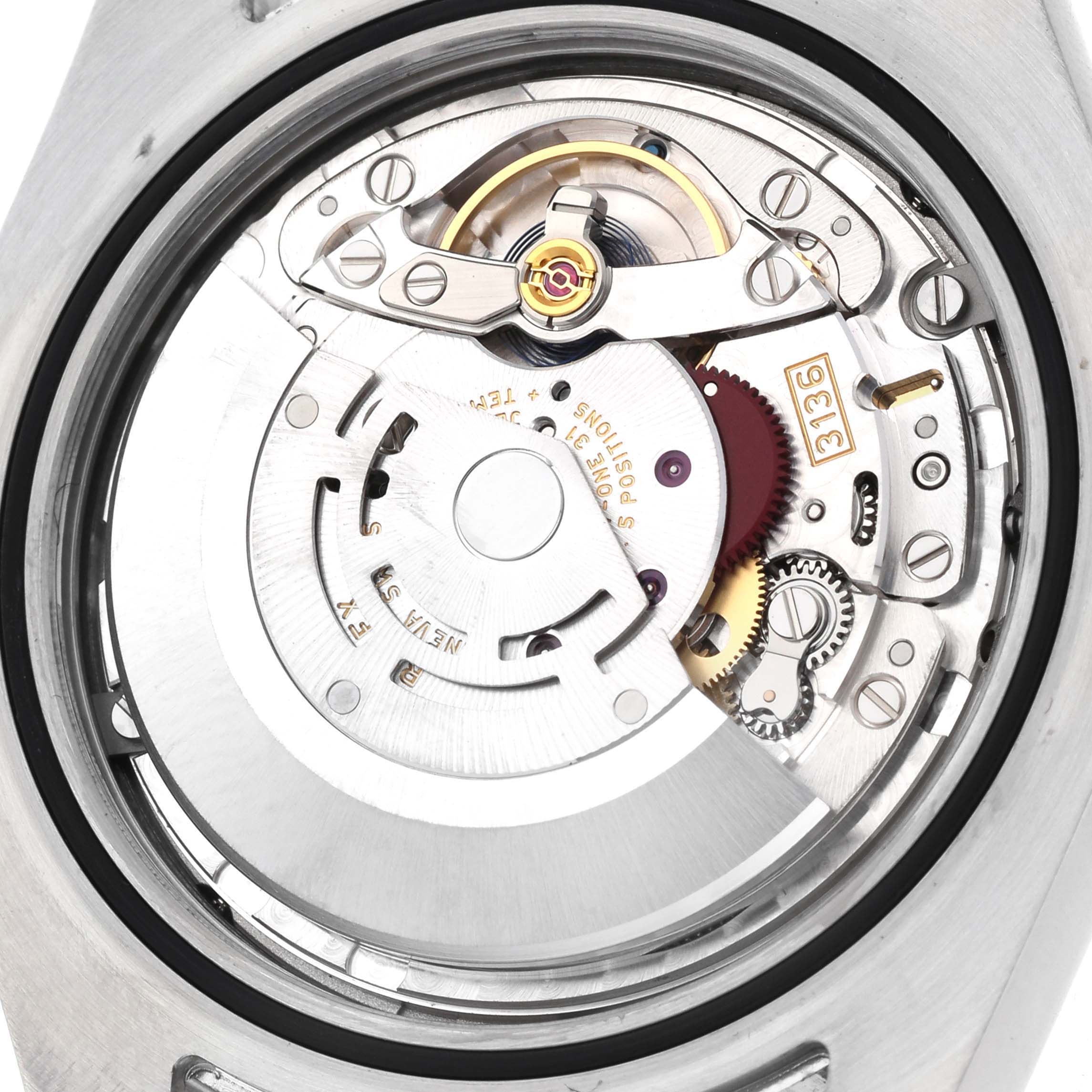 The image shows the Rolex Datejust 41 116300 Men's Stainless Steel Black Dial model's movement viewed from the back, highlighting gears and components.