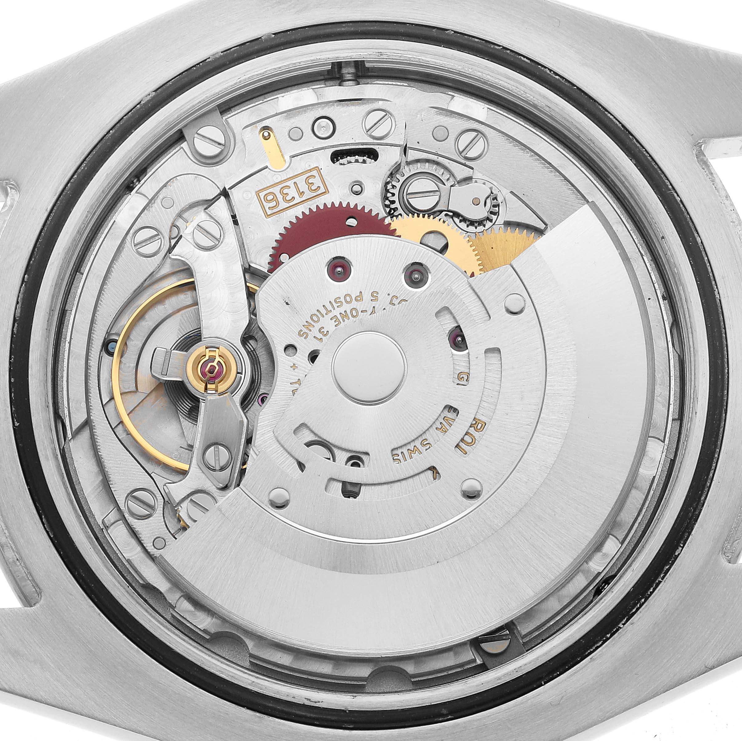 This image shows the movement mechanism of a Rolex Datejust 41 116300 Men's Stainless Steel Silver Dial, viewed from the back of the watch case.