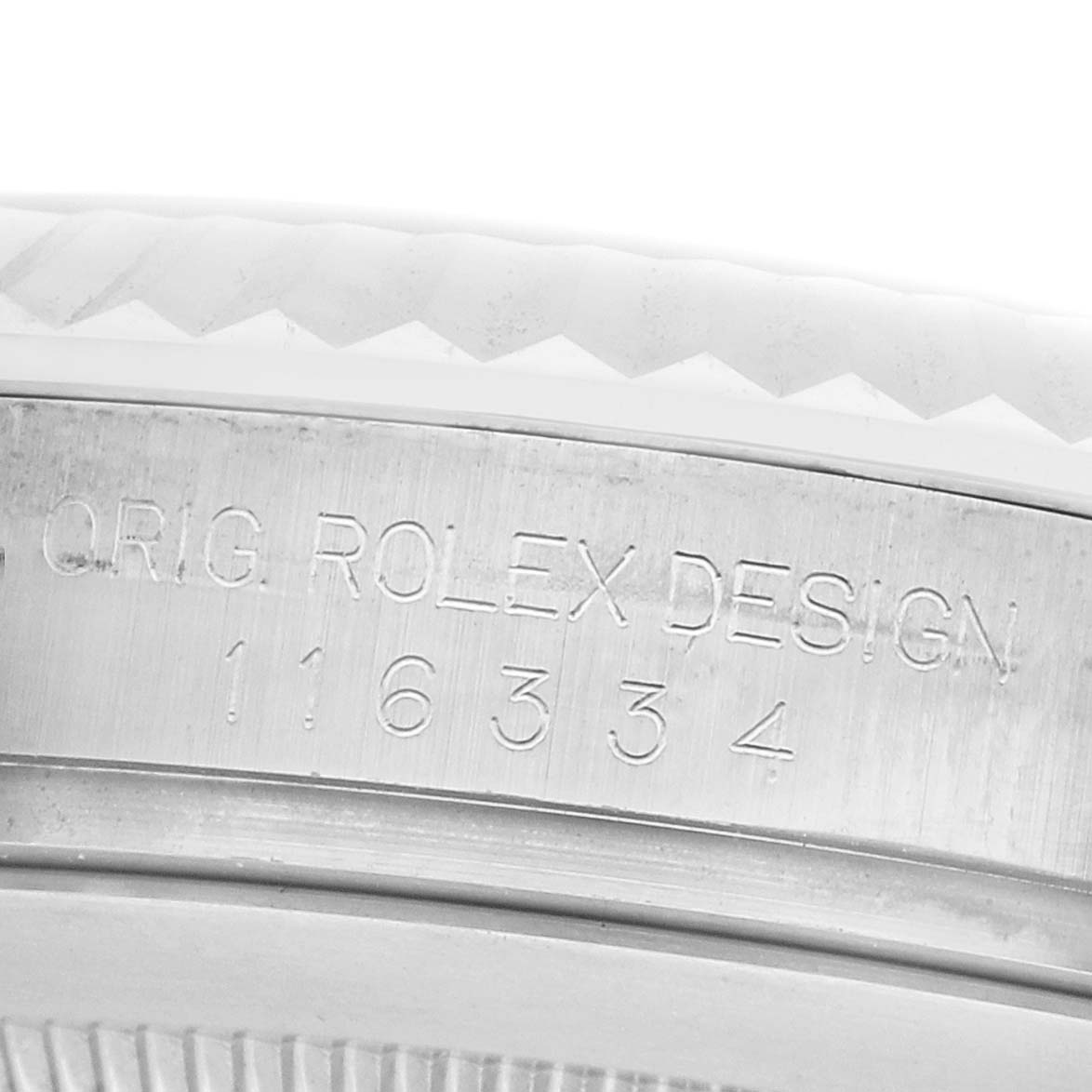 The image shows a close-up of the case side of a Rolex Datejust 41 116334 Men's Stainless Steel Black Dial, focusing on the engraved model number and inscription.