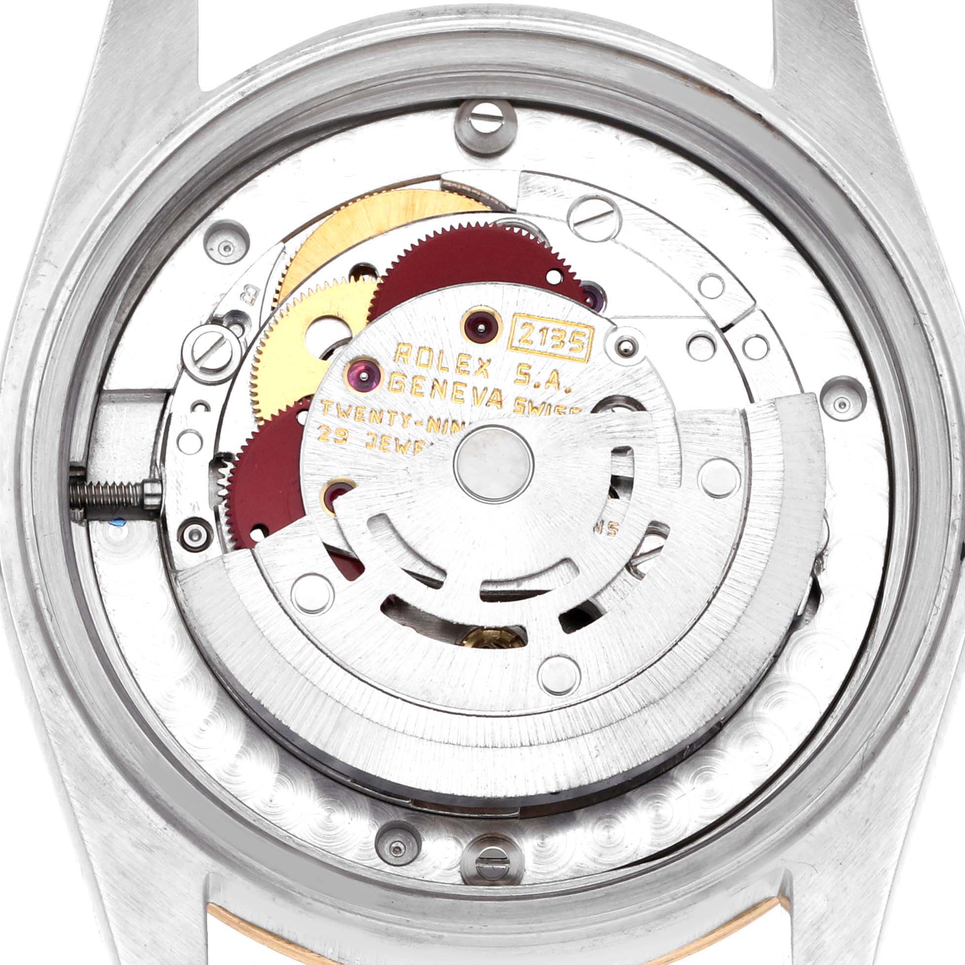 The image shows the back view of a Rolex Mid-Size 68273 Women's Steel and Gold (two tone) Champagne Dial watch, highlighting its inner movement mechanism.