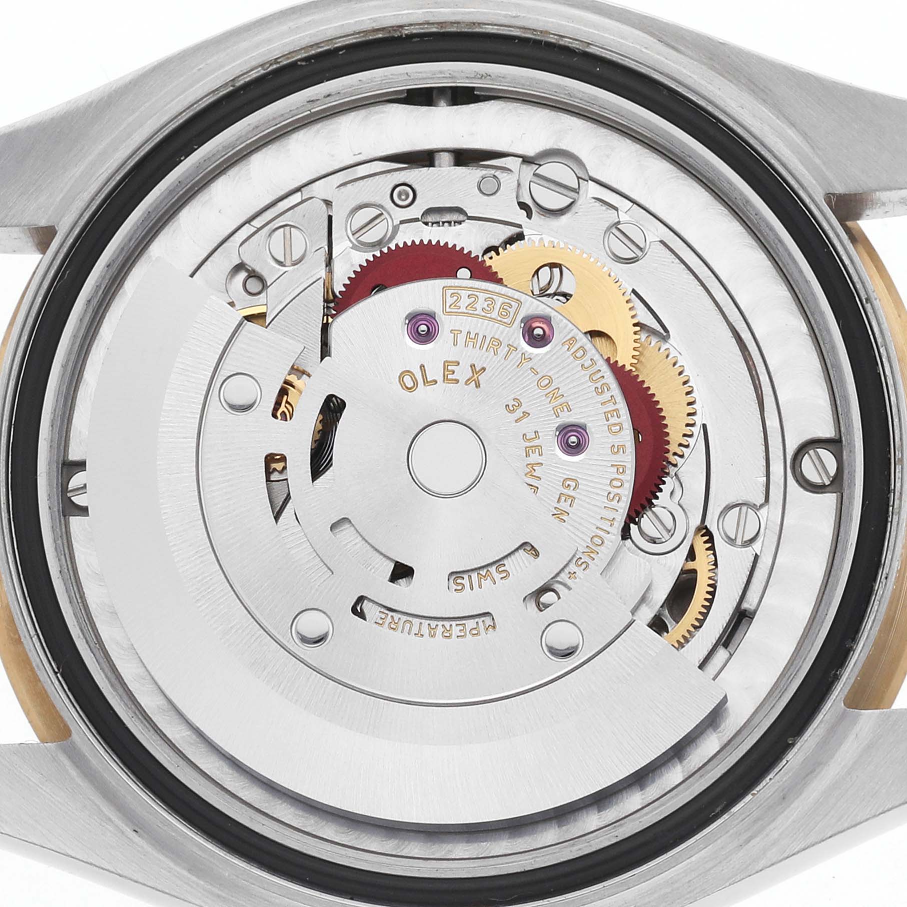 The image shows the back view of a Rolex Mid-Size 278273 Women's Steel and Gold (two tone) White Dial watch, revealing its intricate movement and internal components.
