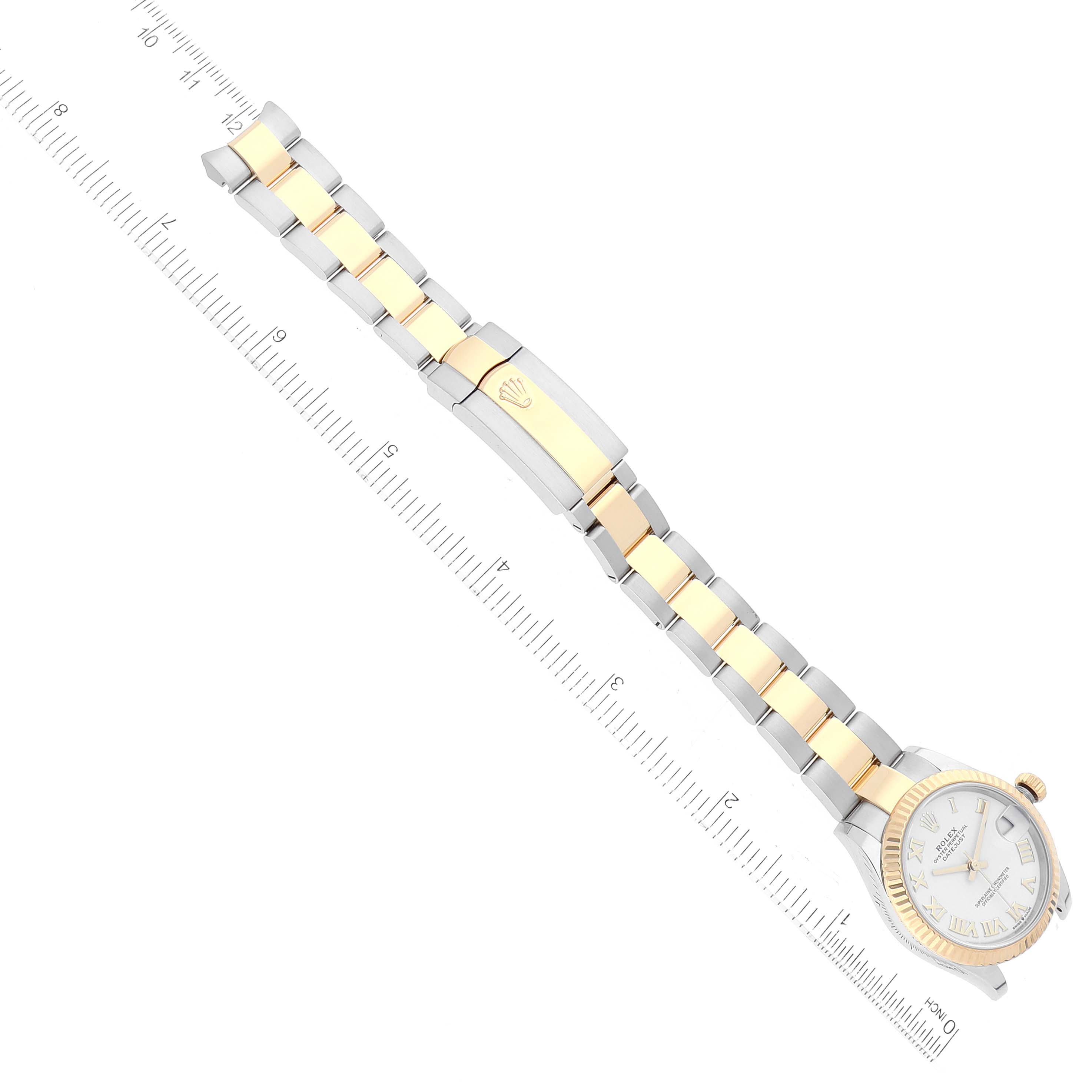 The image shows a top-down view of a Rolex Mid-Size 278273 Women
s Steel and Gold (two tone) White Dial 278273 Women
s Steel and Gold (two tone) White Dial watch, displaying the full bracelet and part of the face alongside a ruler.