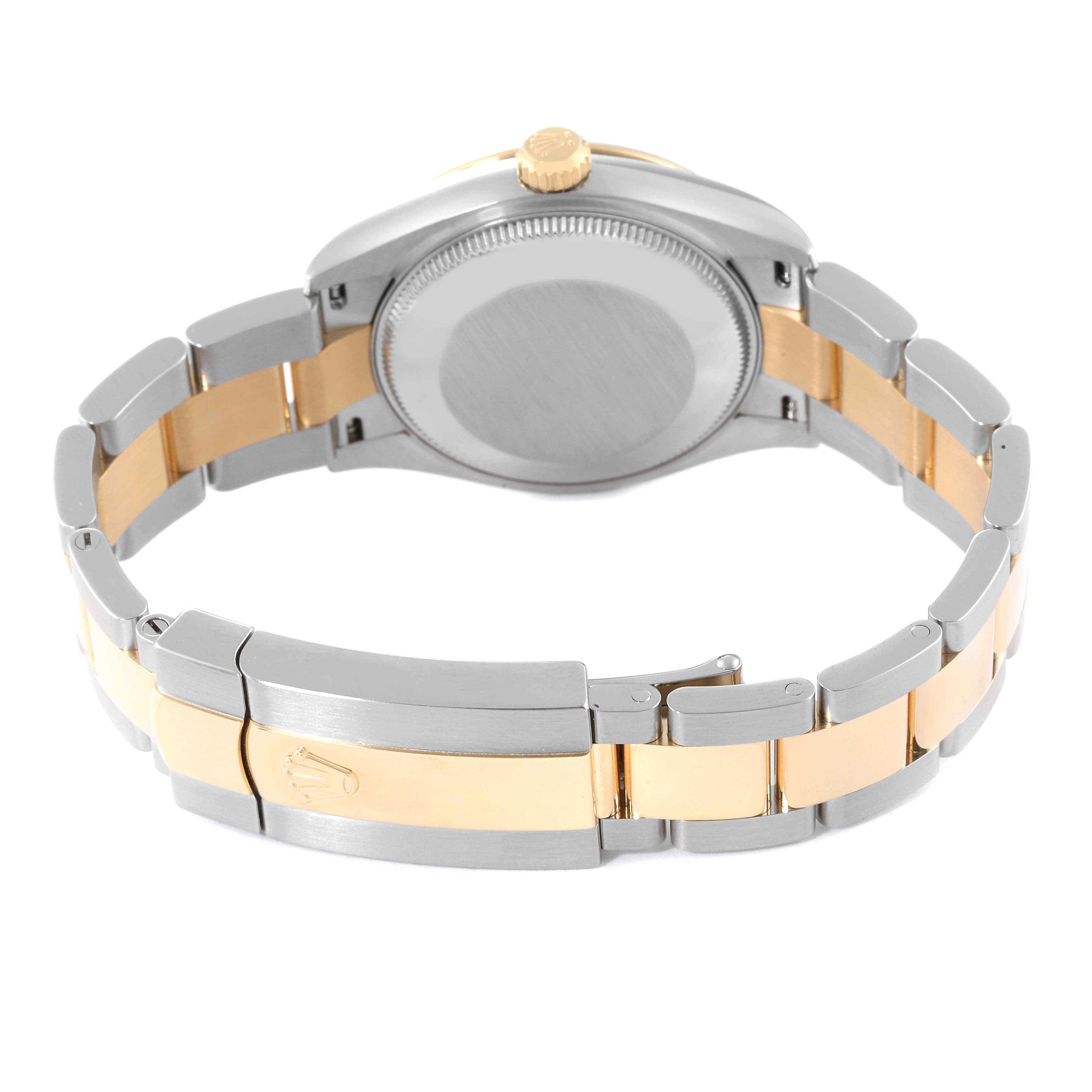 This image shows the back and bracelet of a mid-size Rolex watch, highlighting its metal and gold-tone elements.