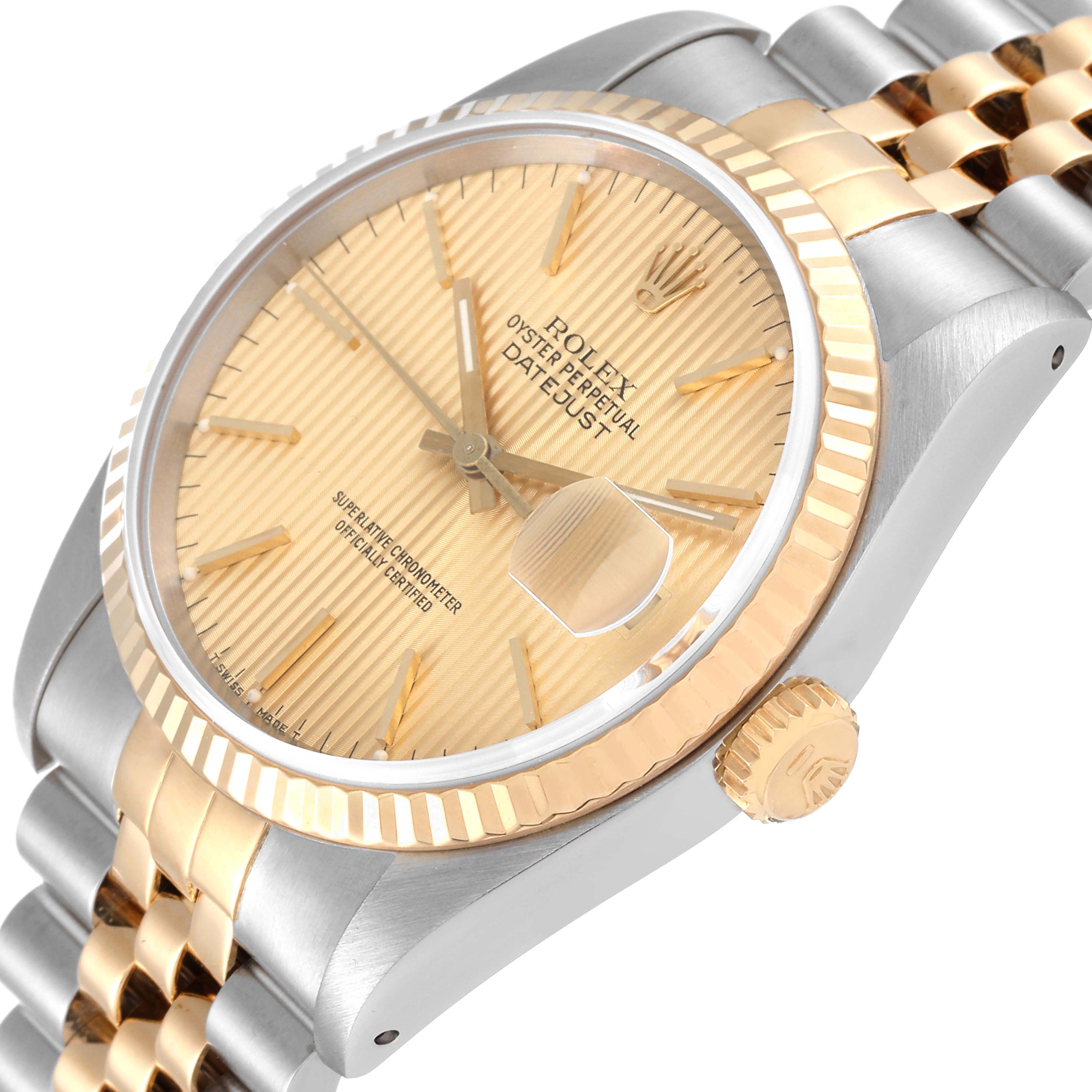 This image of the Rolex Datejust 16233 Men's Steel and Gold (two tone) Champagne Dial 16233 Men's Steel and Gold (two tone) Champagne Dial watch is taken at an angle showing the face, crown, and partial bracelet with a two-tone design.