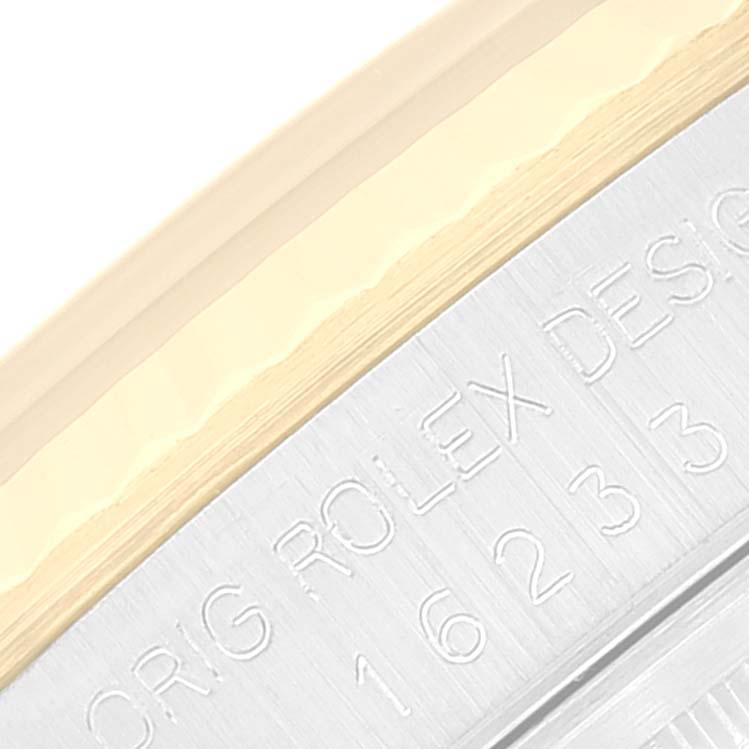 This image shows a close-up of the side of a Rolex Datejust 16233 Men's Steel and Gold (two tone) Champagne Dial 16233 Men's Steel and Gold (two tone) Champagne Dial watch, highlighting the engraved case model number.