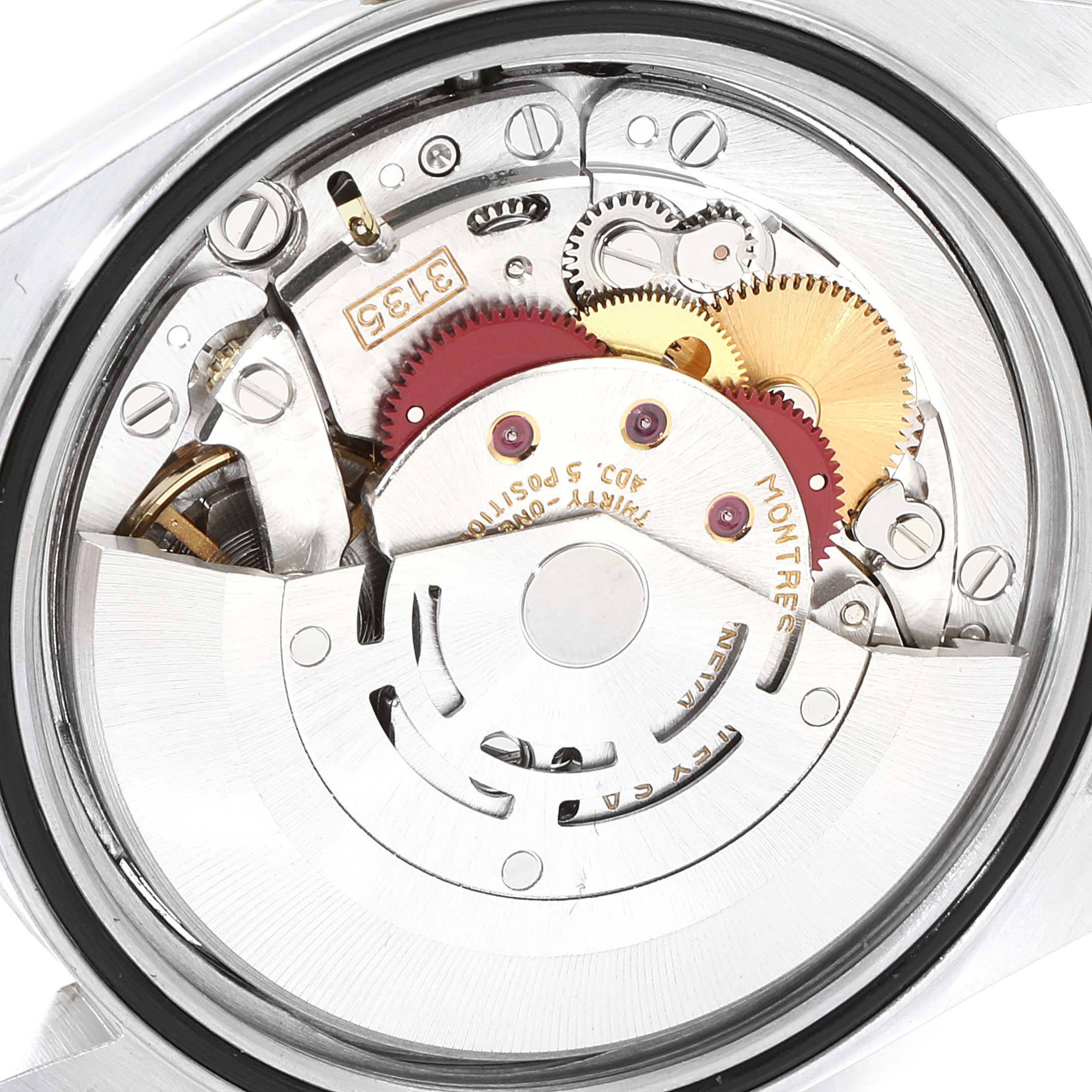 The image shows the internal mechanism of a Rolex Datejust 16233 Men's Steel and Gold (two tone) Champagne Dial 16233 Men's Steel and Gold (two tone) Champagne Dial model, viewed from the back to reveal the moving gears and components.
