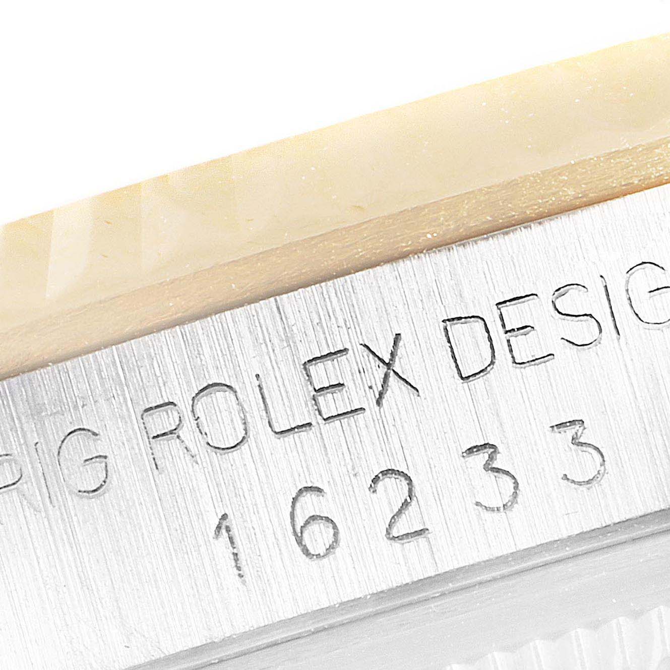 This image shows a close-up angle of the case side, including the engraved serial number of the Rolex Datejust 16233 Men's Steel and Gold (two tone) Champagne Dial 16233 Men's Steel and Gold (two tone) Champagne Dial watch model.