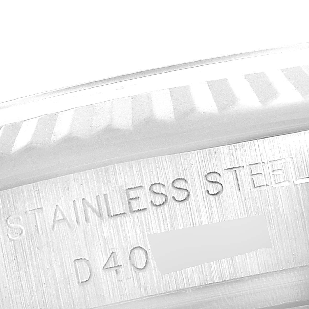 This close-up image shows the engraved text "STAINLESS STEEL" on the edge of a Rolex Datejust 179174 Women's Stainless Steel Silver Dial 179174 Women's Stainless Steel Silver Dial watch.