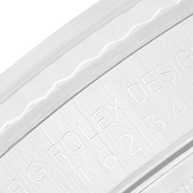 This close-up image shows the engraved serial number and "ROLEX DESIGN" text on the rim of a Rolex Datejust 16234 Men's Stainless Steel Pink Dial 16234 Men's Stainless Steel Pink Dial watch.