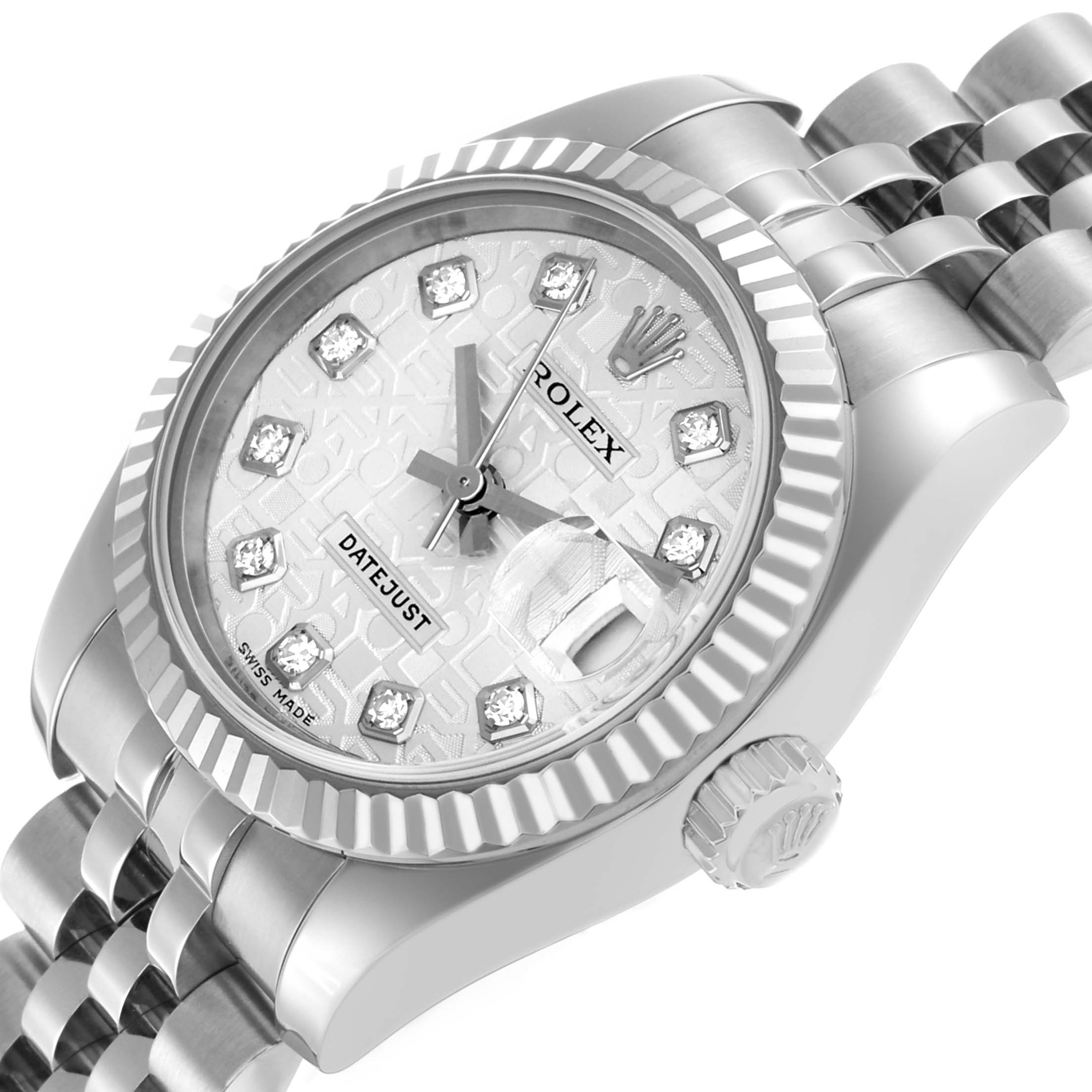 The Rolex Datejust 179174 Women's Stainless Steel Silver Dial watch is shown at a three-quarter angle, highlighting the face, bezel, crown, and part of the bracelet.