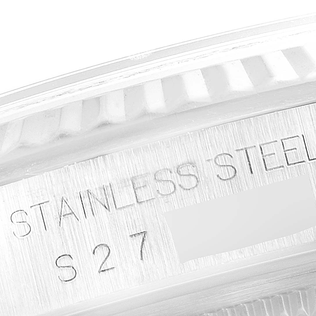 A close-up of the side of a Rolex Datejust 16234 Men's Stainless Steel Silver Dial 16234 Men's Stainless Steel Silver Dial watch, highlighting the text "STAINLESS STEEL S27."