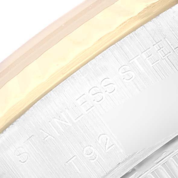 The image shows a close-up angle of the bezel edge and part of the case of a Rolex Datejust 69173 Women's Steel and Gold (two tone) Beige Dial 69173 Women's Steel and Gold (two tone) Beige Dial model, highlighting the stainless steel detail.