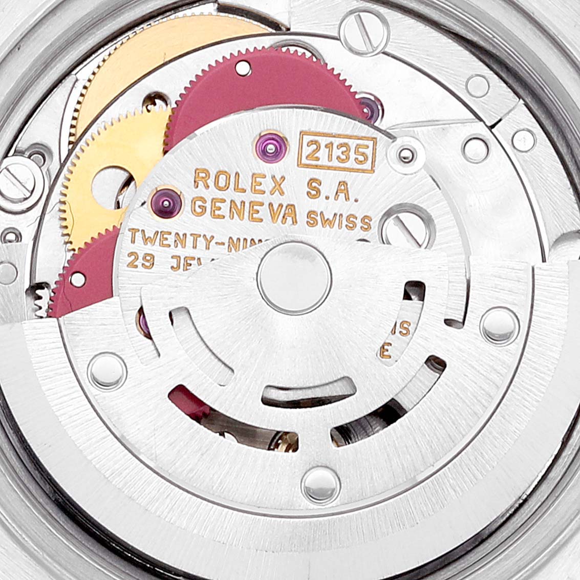 This image shows the intricate internal mechanism of a Rolex Datejust 69173 Women's Steel and Gold (two tone) Beige Dial 69173 Women's Steel and Gold (two tone) Beige Dial watch, specifically the movement with visible gears and inscriptions.