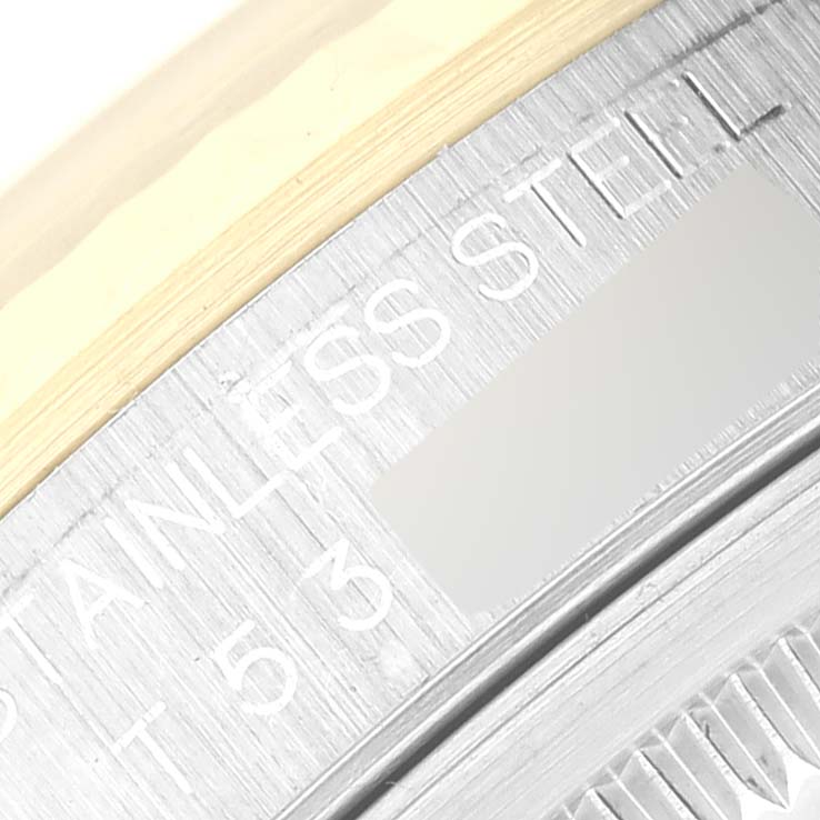 The image shows a close-up of the engraved text on the case back of a Rolex Datejust 16233 Men's Steel and Gold (two tone) Silver Dial 16233 Men's Steel and Gold (two tone) Silver Dial watch, including "STAINLESS STEEL."