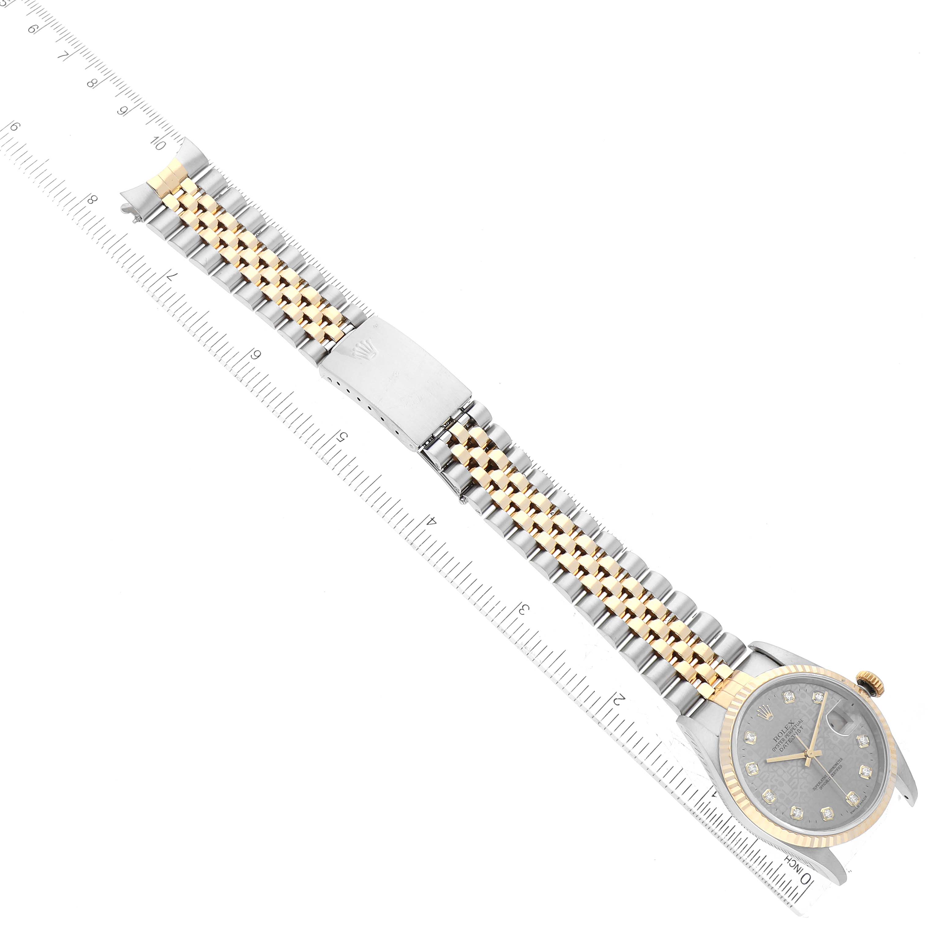 This Rolex Datejust 16233 Men's Steel and Gold (two tone) Silver Dial 16233 Men's Steel and Gold (two tone) Silver Dial watch is displayed flat, showing the face, bezel, band, and clasp, with a ruler for scale.