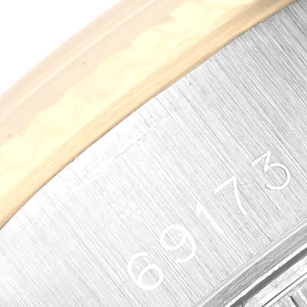 This image shows a close-up of the case back and part of the bezel of a Rolex Datejust 69173 Women's Steel and Gold (two tone) Champagne Dial 69173 Women's Steel and Gold (two tone) Champagne Dial watch, including the model number 69173.