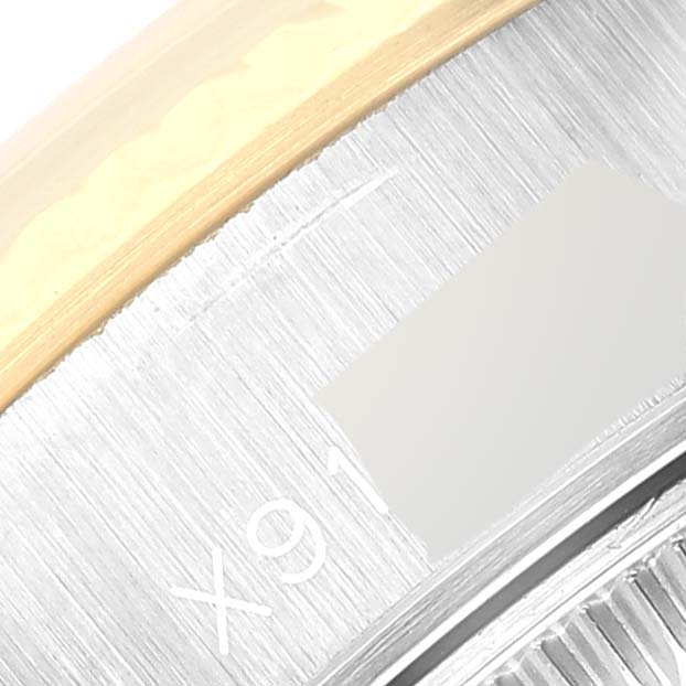 The image shows a close-up view of the bezel and dial of a Rolex Datejust 69173 Women's Steel and Gold (two tone) Champagne Dial 69173 Women's Steel and Gold (two tone) Champagne Dial watch, highlighting part of the date window.