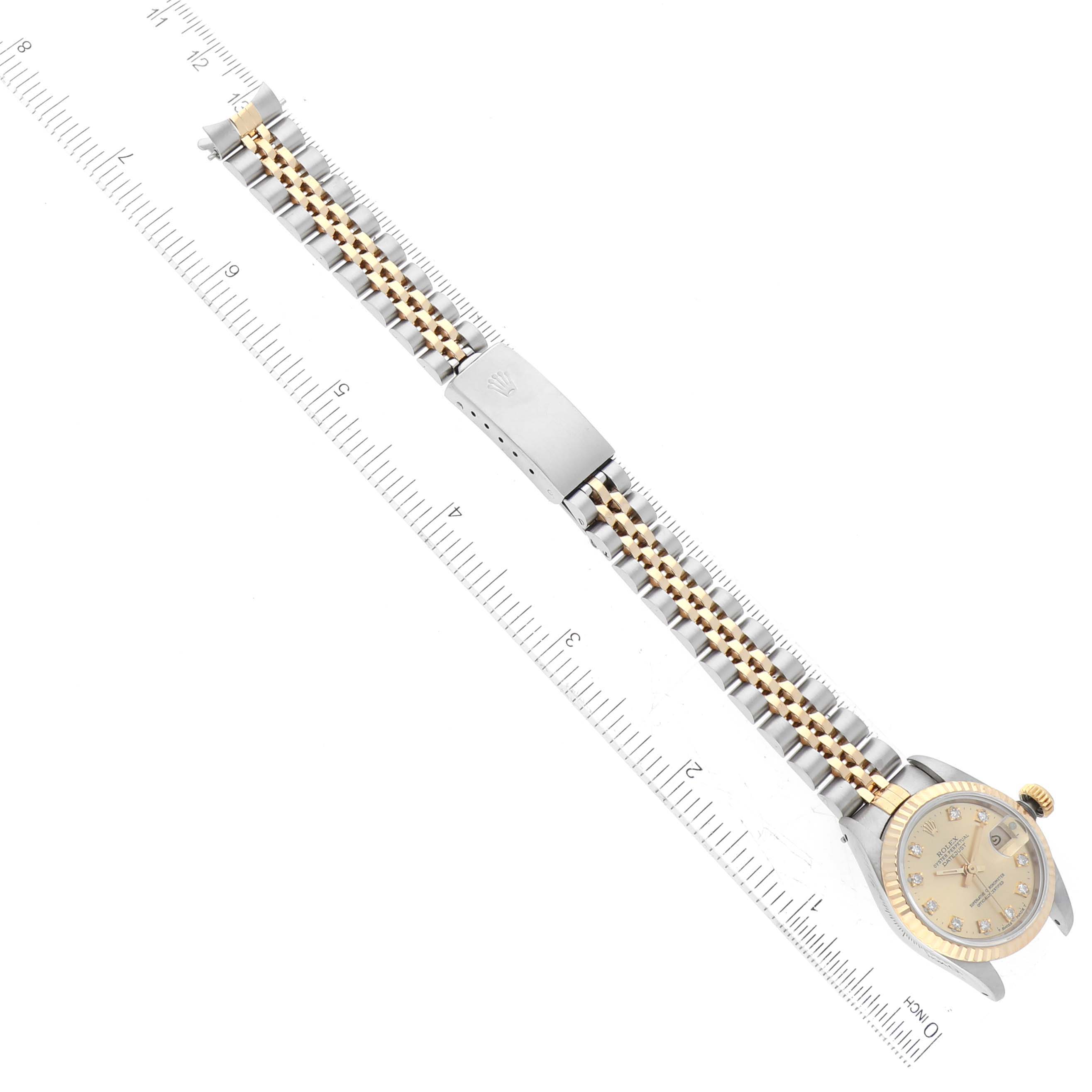 This image shows a top-down view of a Rolex Datejust 69173 Women's Steel and Gold (two tone) Champagne Dial 69173 Women's Steel and Gold (two tone) Champagne Dial watch, including its face, band, and clasp.