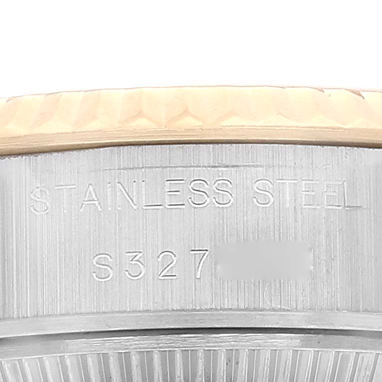 This is a close-up angle of the side of a Rolex Datejust 69173 Women's Steel and Gold (two tone) Champagne Dial 69173 Women's Steel and Gold (two tone) Champagne Dial watch, showing the stainless steel material engraving.